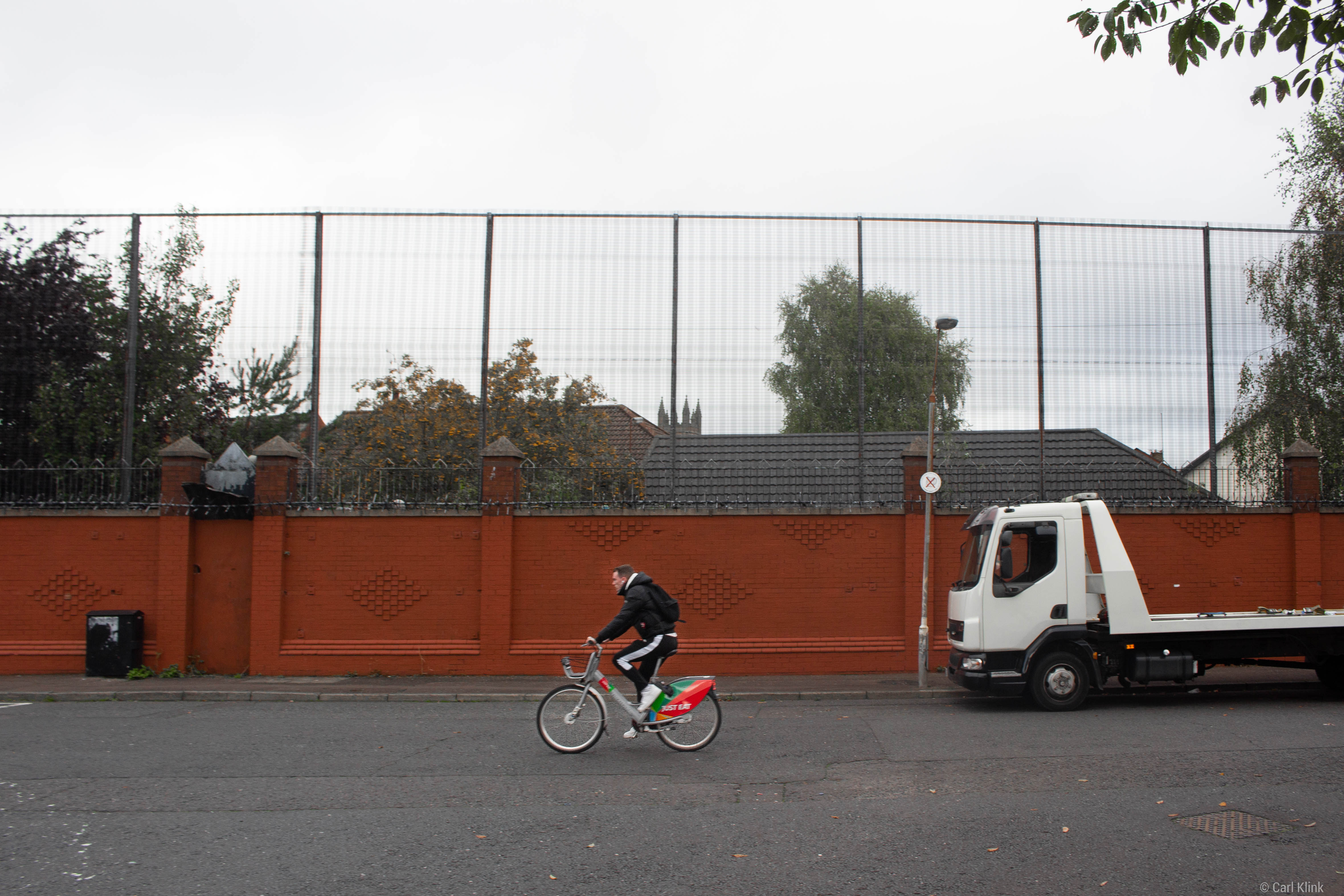 The peace wall surrounding Short Strand in east Belfast. Many houses directly face the wall