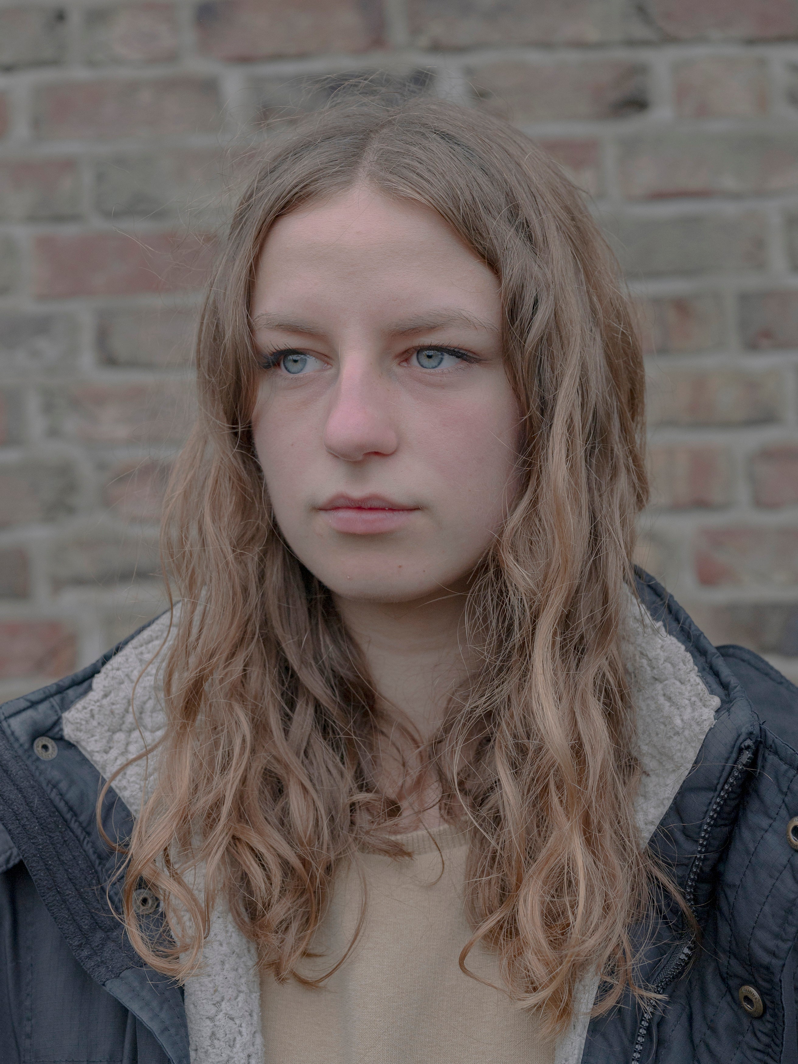 Tina Dresen in front of her family’s home in Kuckum where she feels rooted