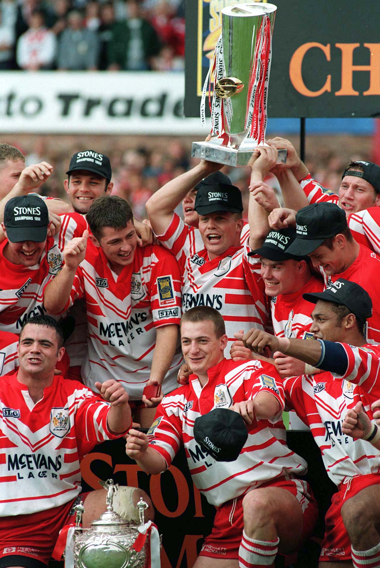 Bobbie Goulding, holding the trophy, celebrates with team-mates after St Helens won the 1996 Challenge Cup final