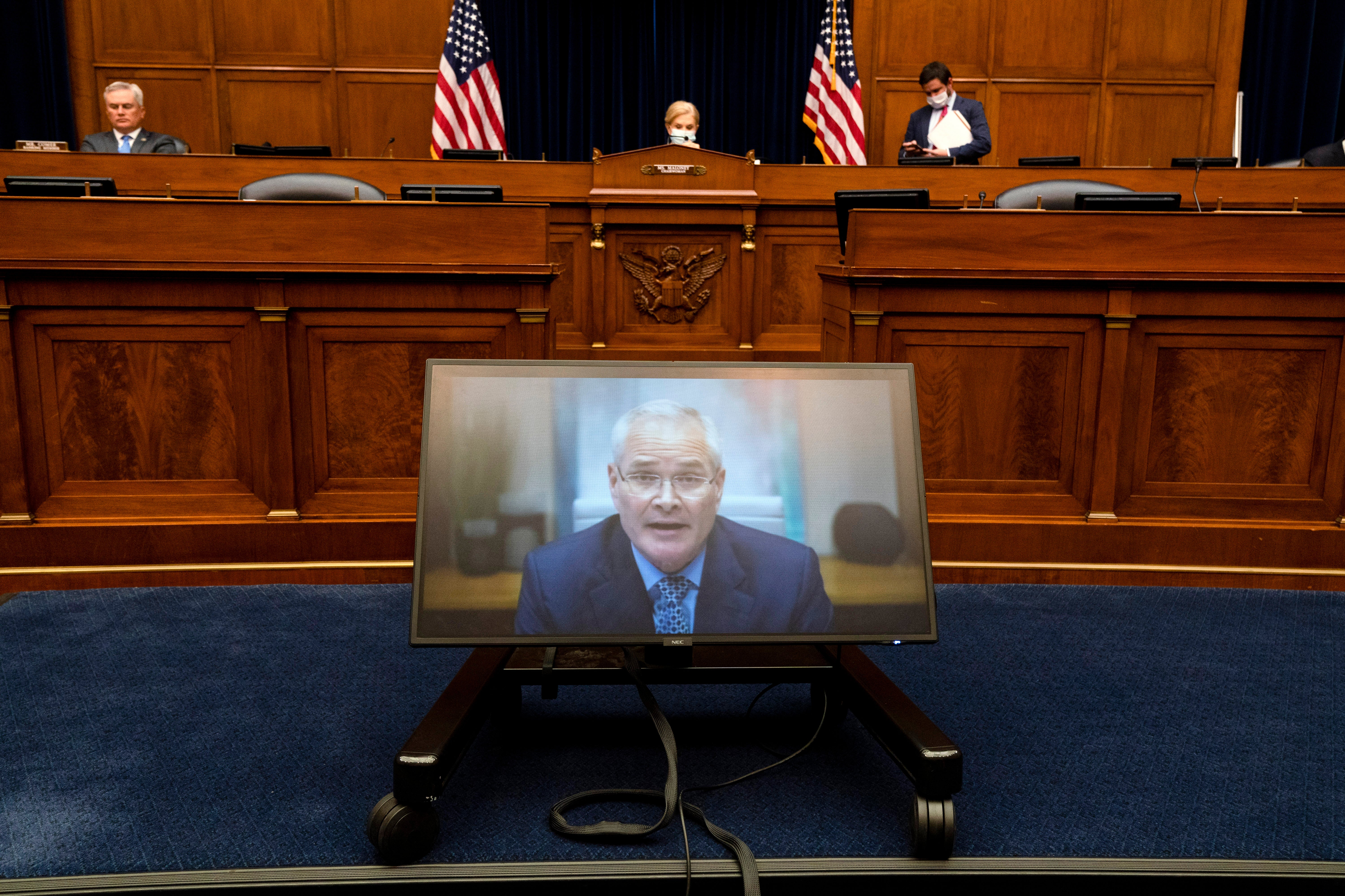 Darren Woods, CEO of ExxonMobil testifies via video link to the House oversight committee