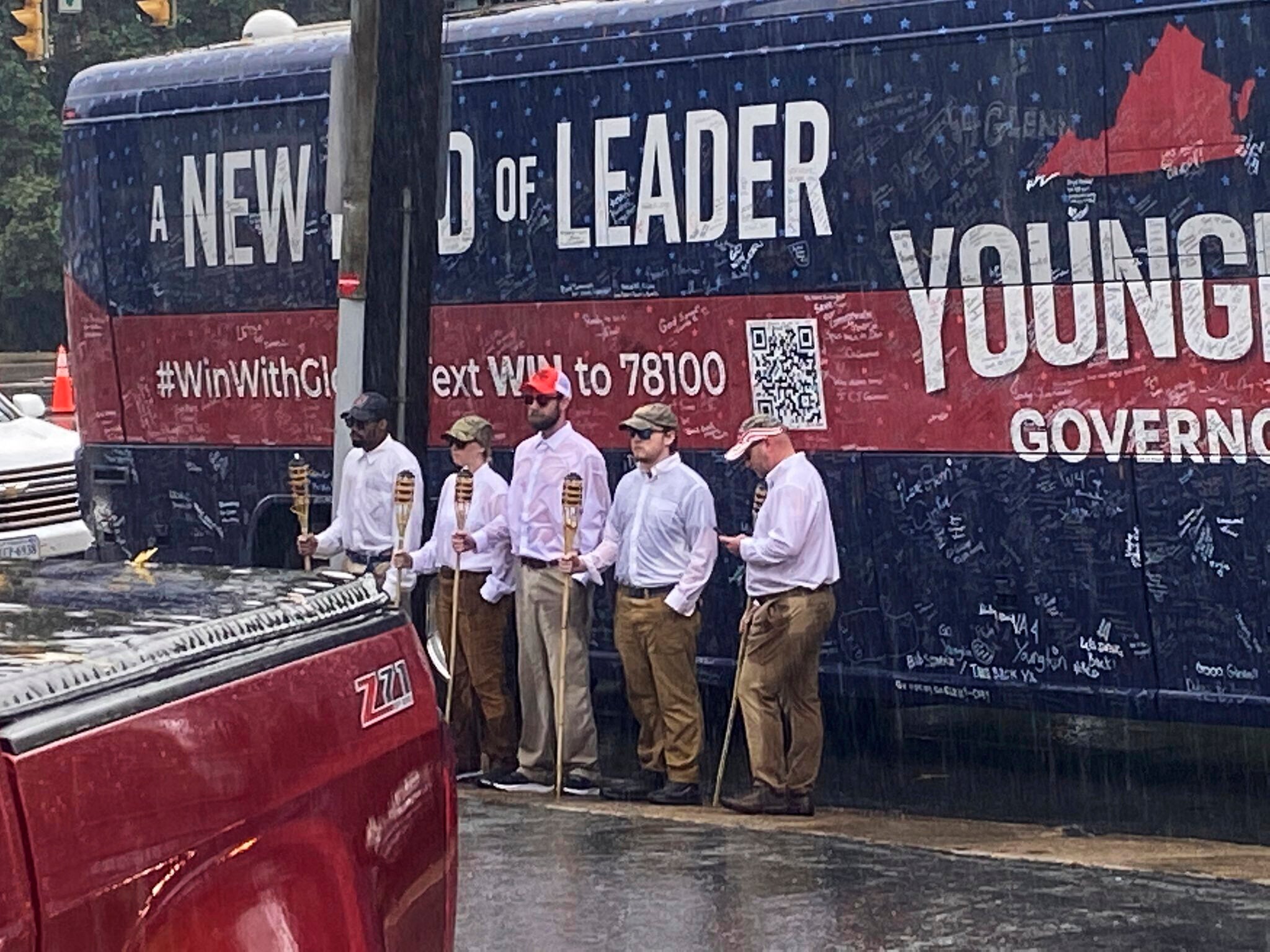 The Lincoln Project has taken credit for a stunt in which five people with tiki torches stood outside Glenn Youngkin’s campaign bus