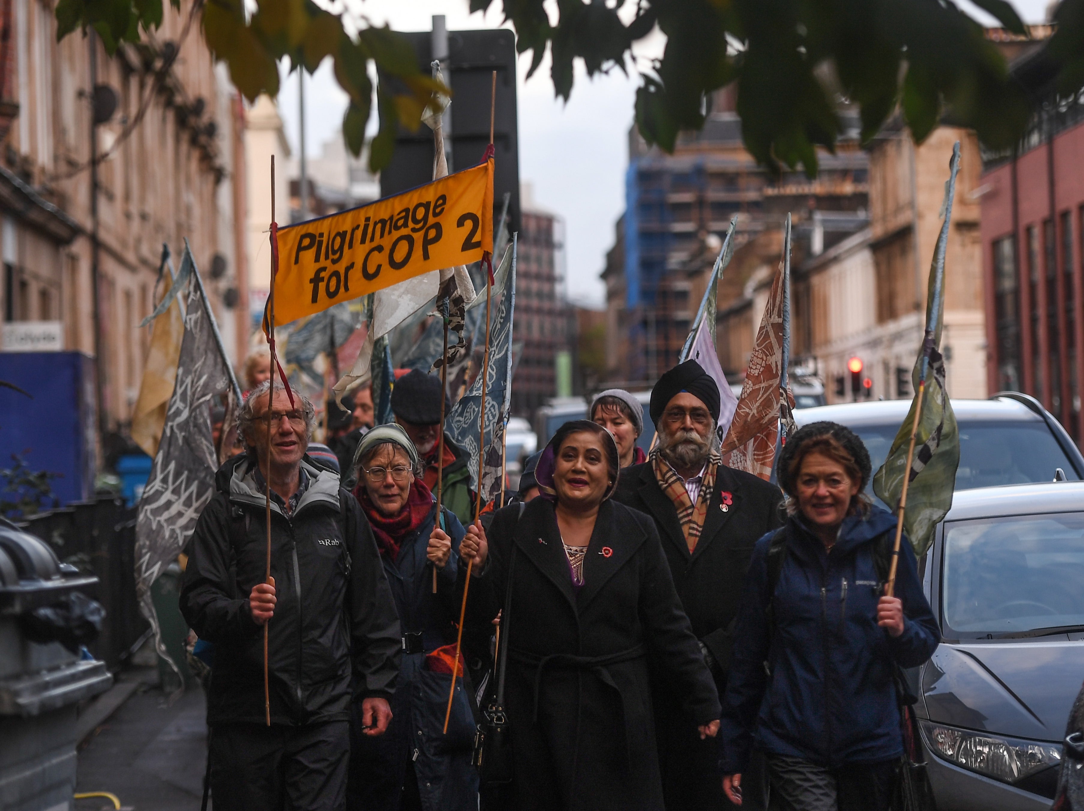 Pilgrims arrive in Glasgow to call for climate action after walking thousands of miles for Cop26