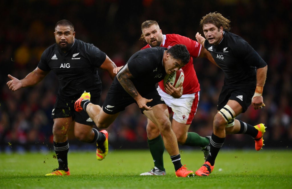 Codie Taylor smashes through the Wales defence in the rout at the Principality Stadium