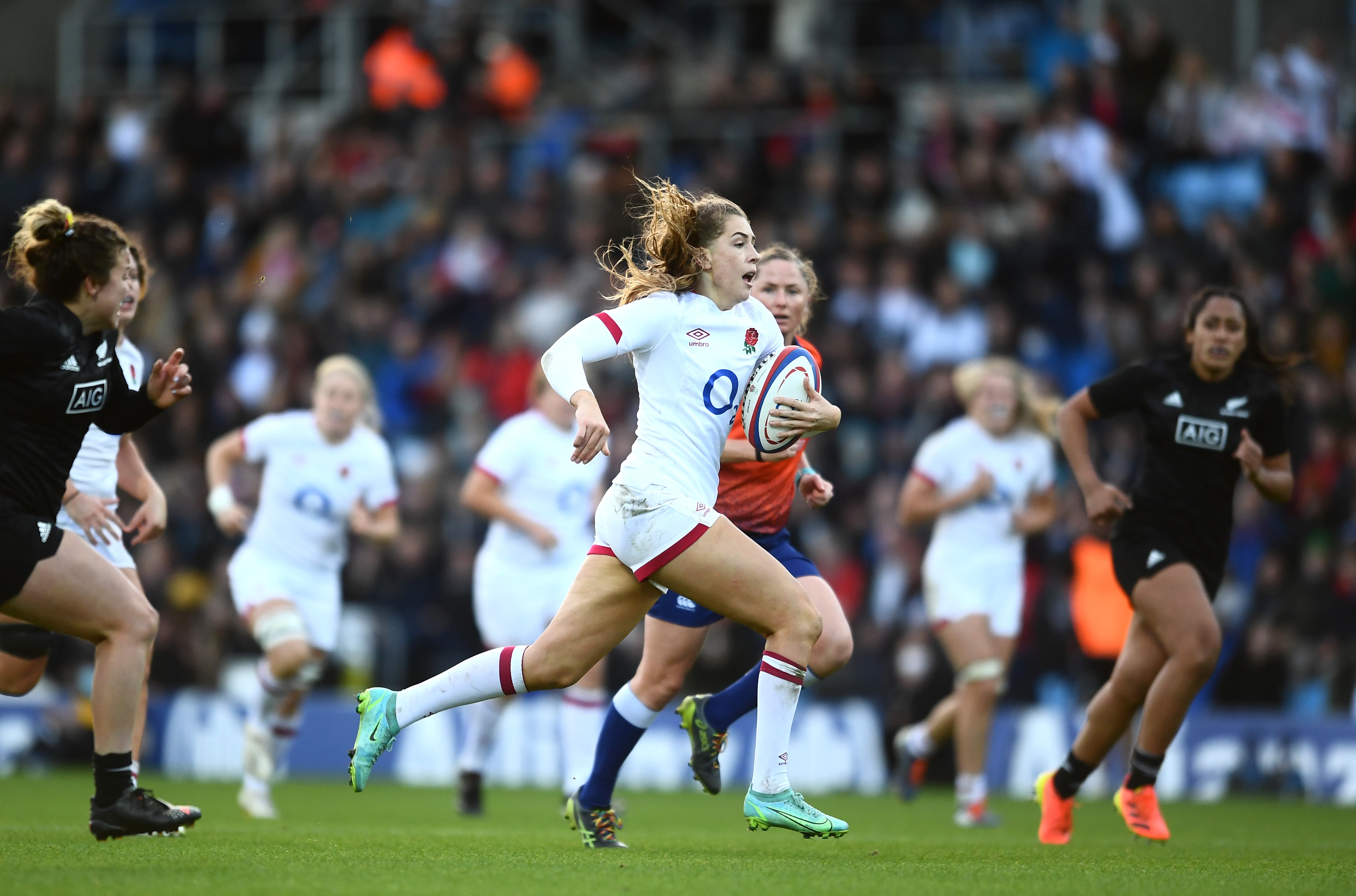 Holly Aitchison of England breaks away before scoring their side's fifth try