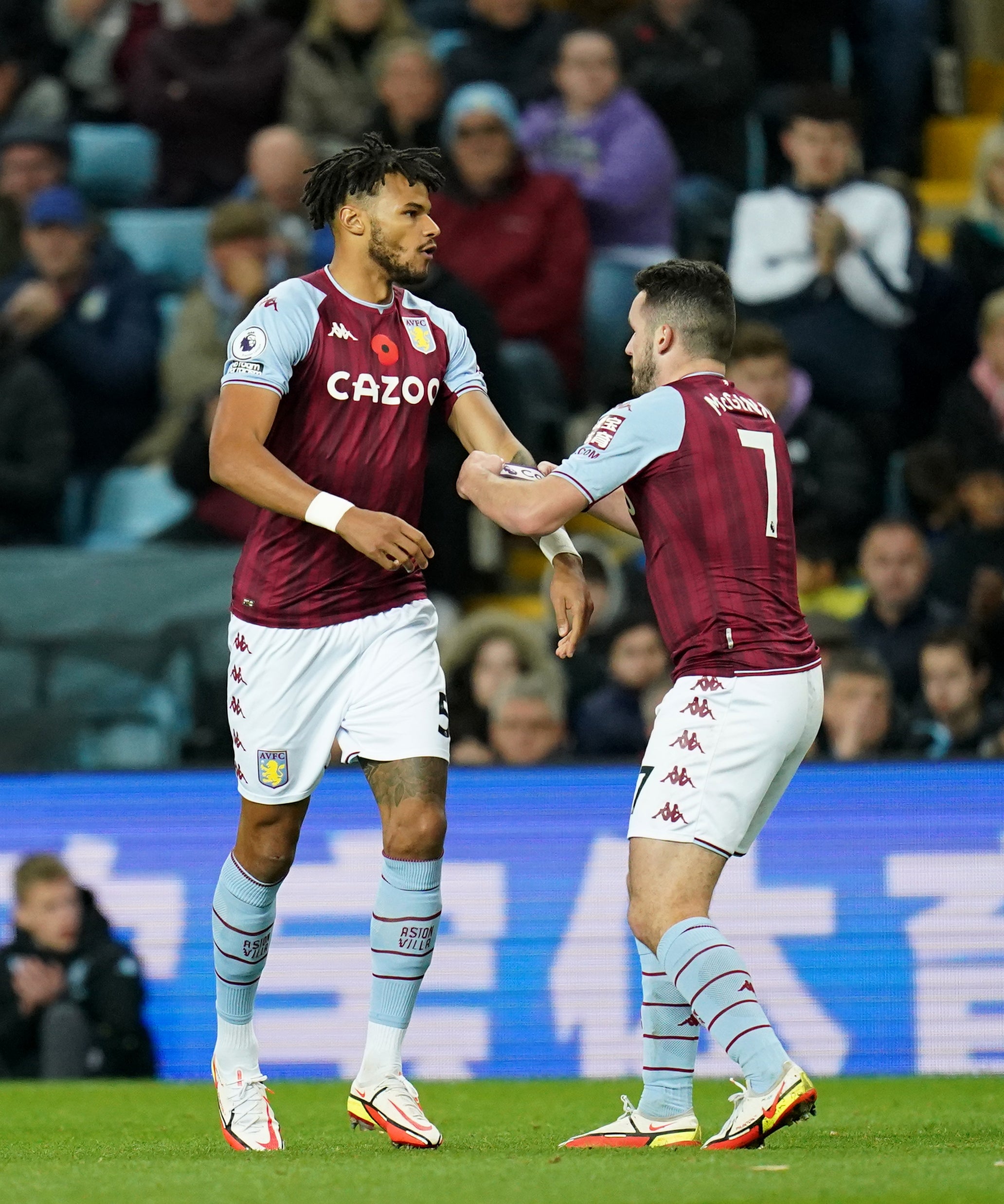 Tyrone Mings, left, is given the captain’s armband by John McGinn after coming on as a substitute (Nick Potts/PA)