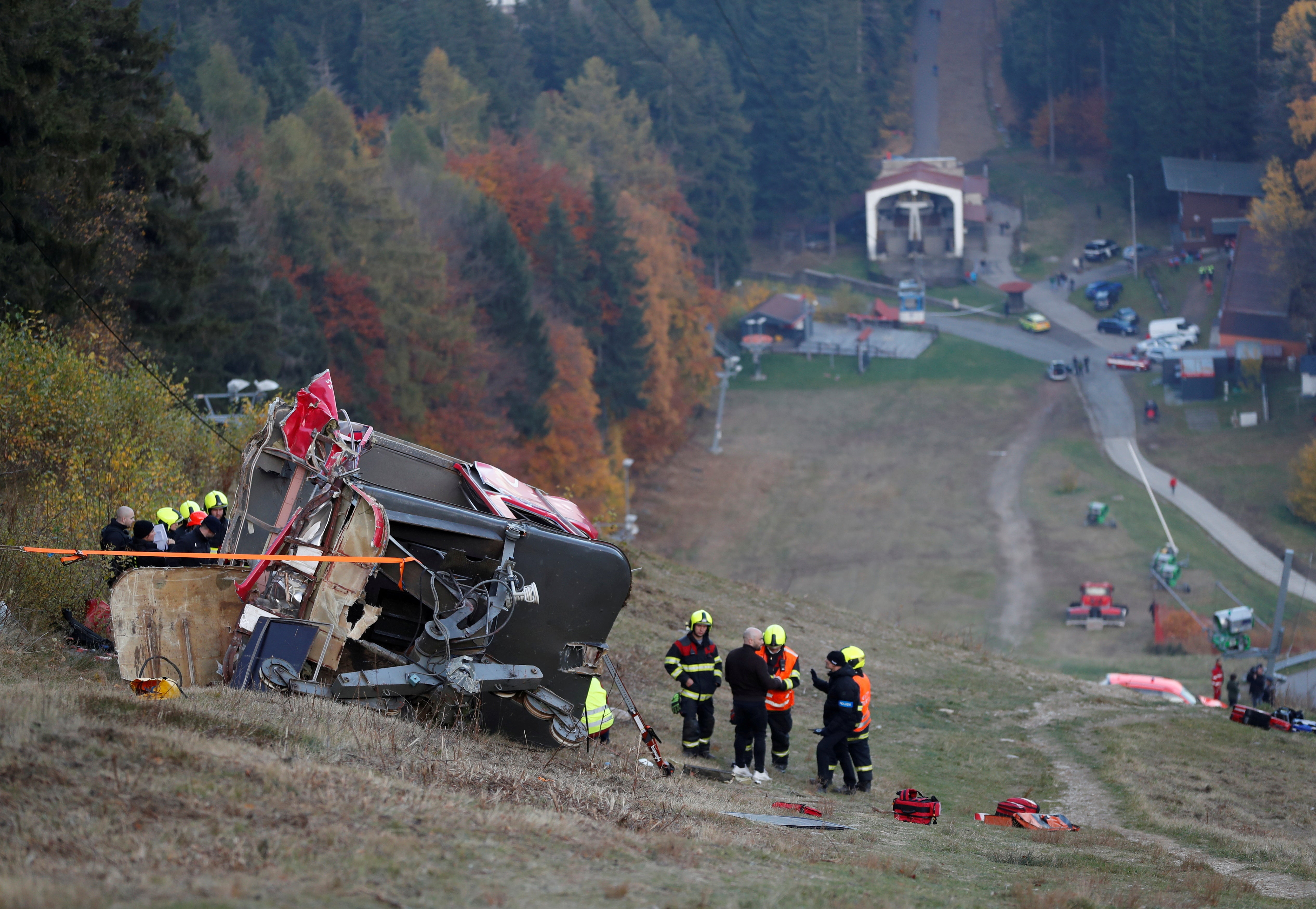 Police and rescue service members are seen near the crashed cable car in Liberec, Czech Republic