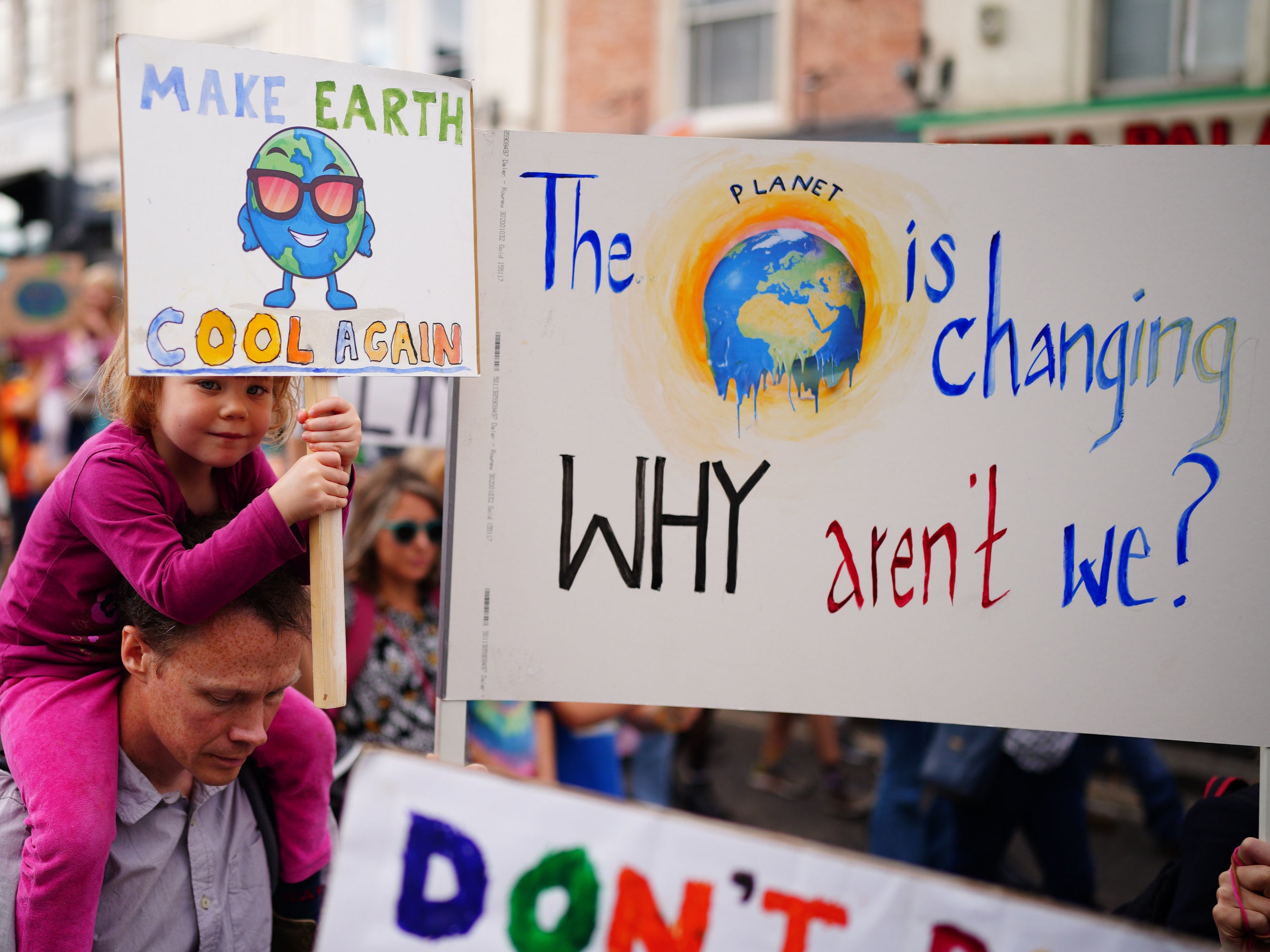 Parents and children take part in a global youth climate strike in Bristol, one of more than 1,000 events taking place around the world just over a month before the UN Cop26 climate talks in Glasgow