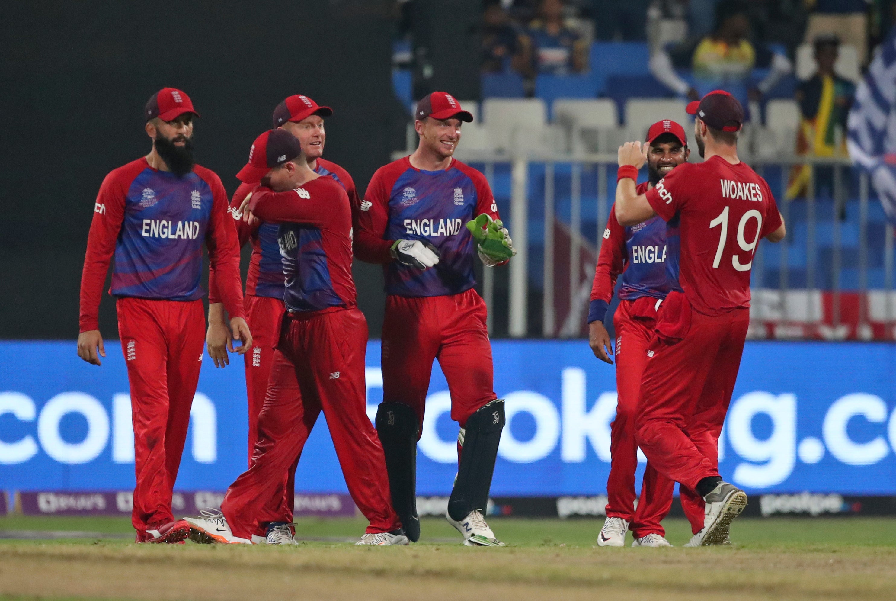 Jos Buttler, centre, brilliantly threw down the stumps of Dasun Shanaka to help England to victory (Aijaz Rahi/AP)