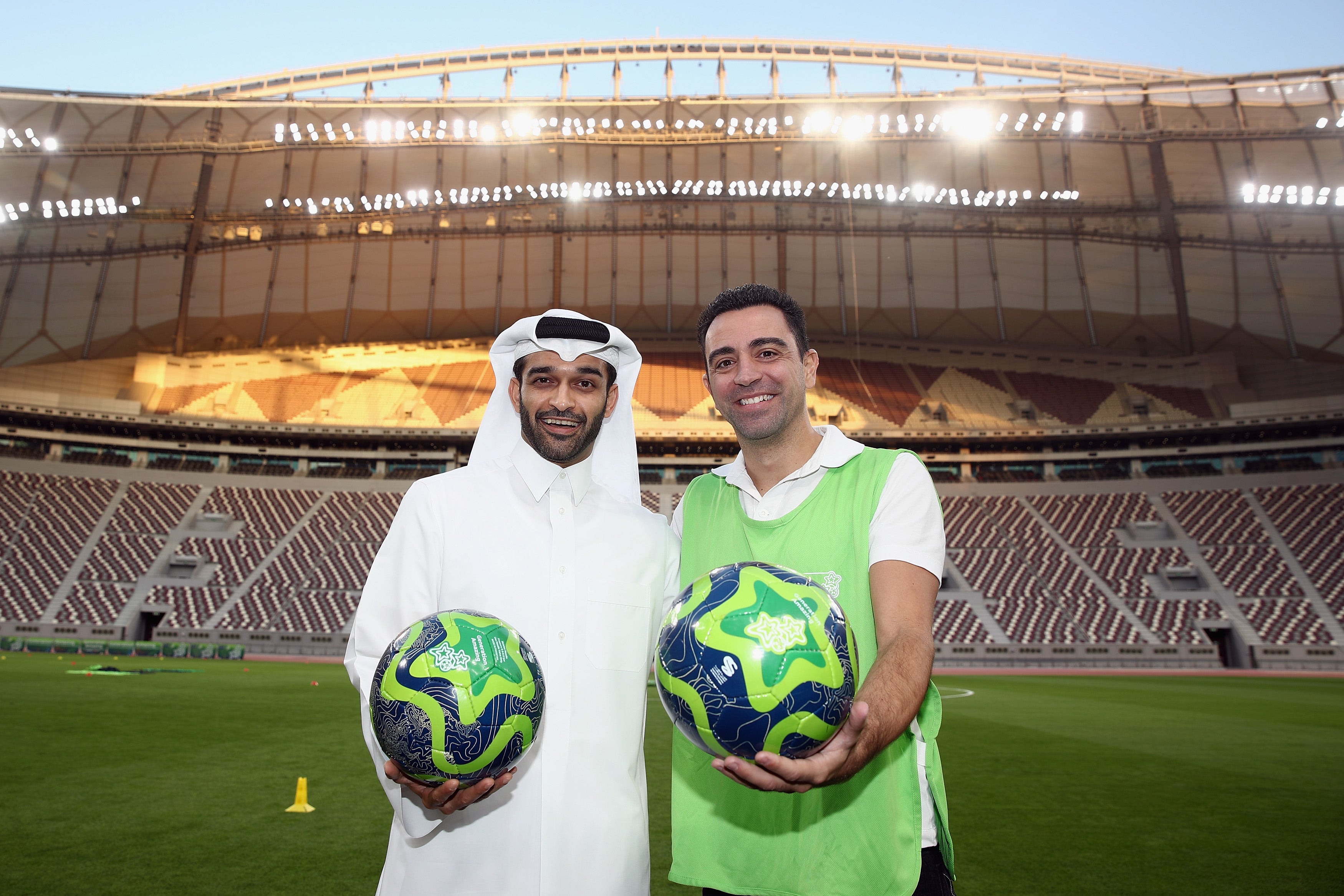 Hassan Al Thawadi poses with Xavi Hernandez, the former Spanish football player and World Cup 2022 ambassador