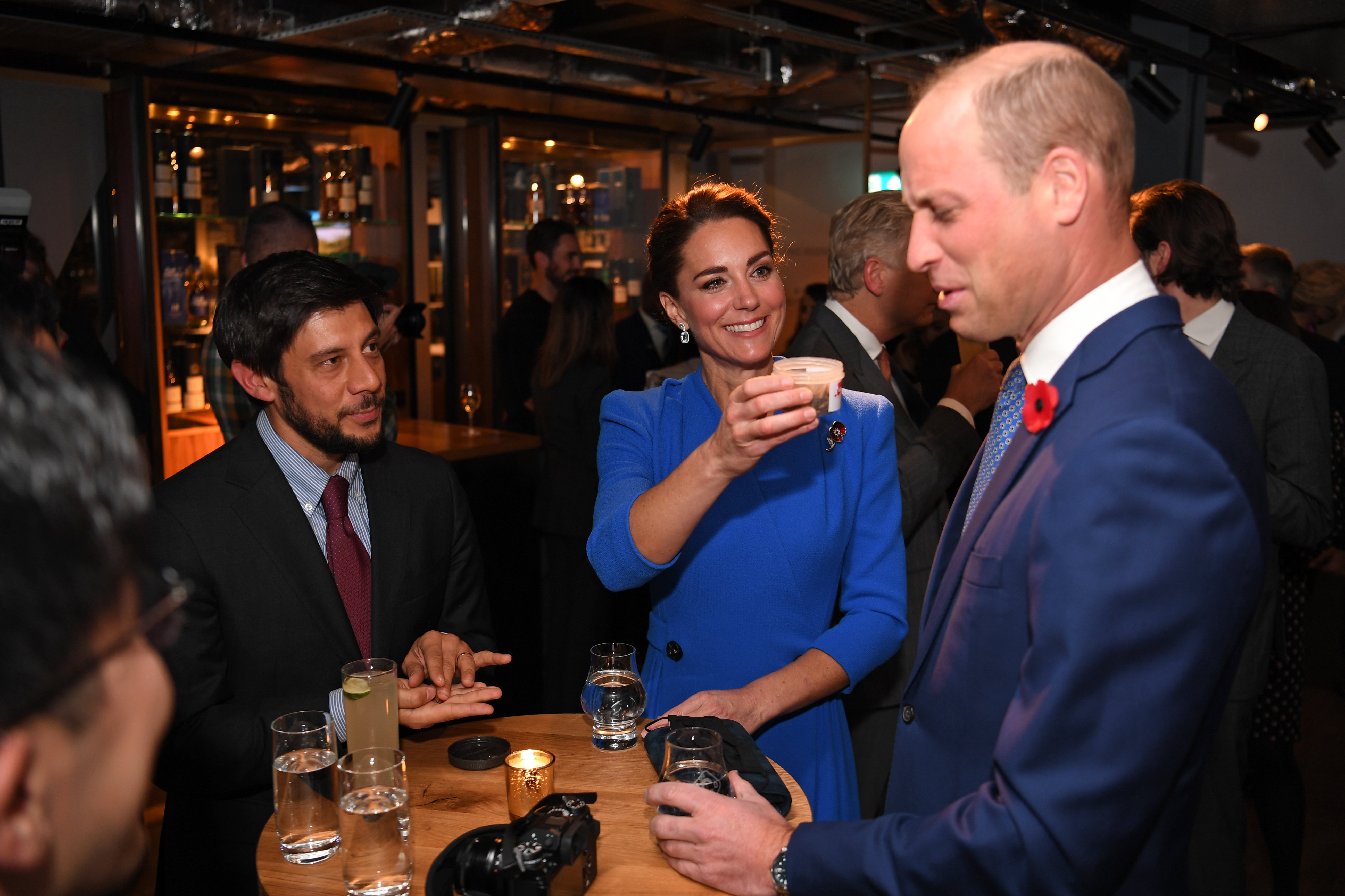 Kate Middleton offers a jar of dead larvae to Prince William during COP26 event