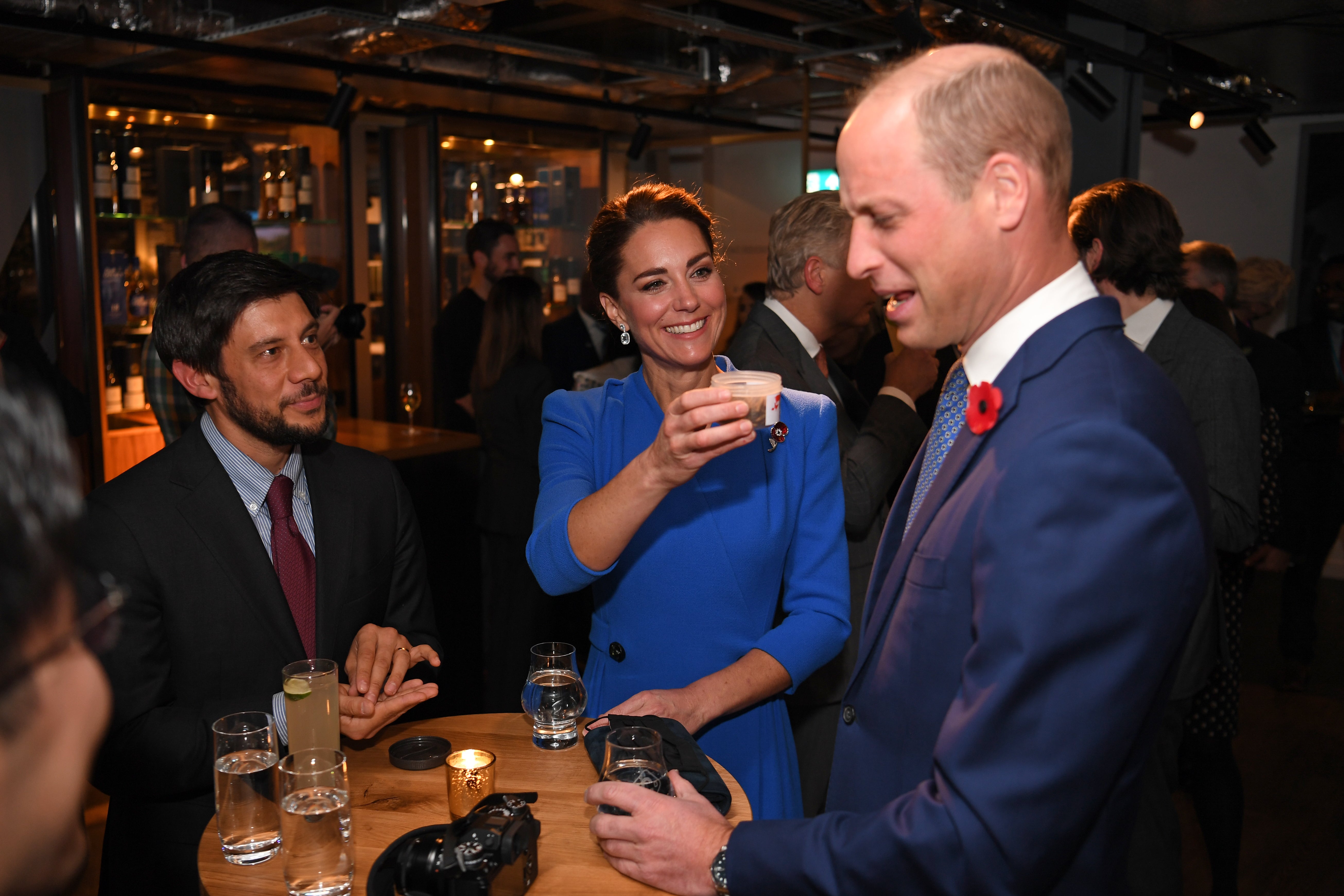 Kate Middleton smiled as she jokingly offered Prince William a jar of dead bugs