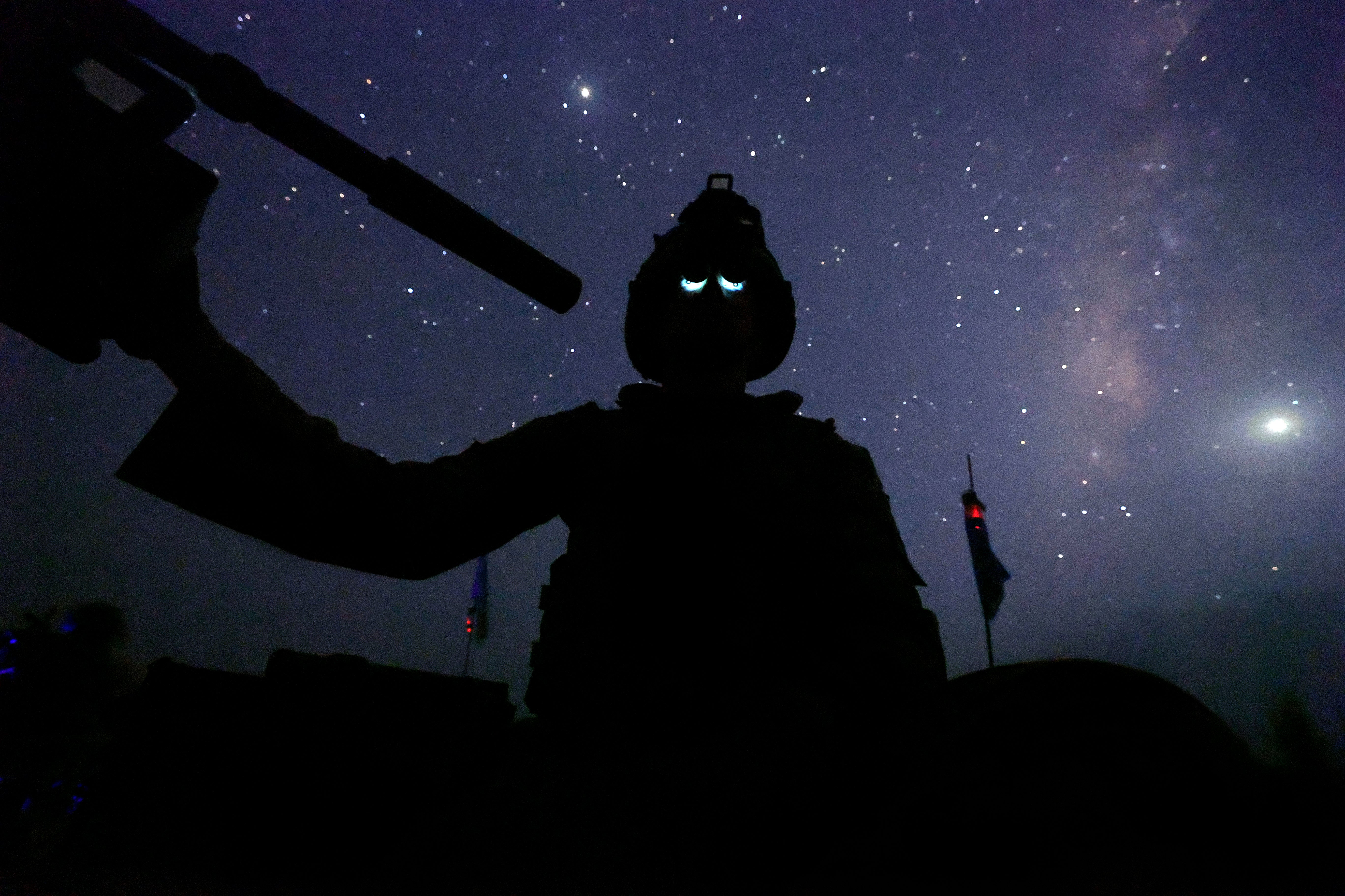 British troops from the 2nd Battalion Royal Anglian Regiment and the Queen’s Dragoon Guards operating on a night mission