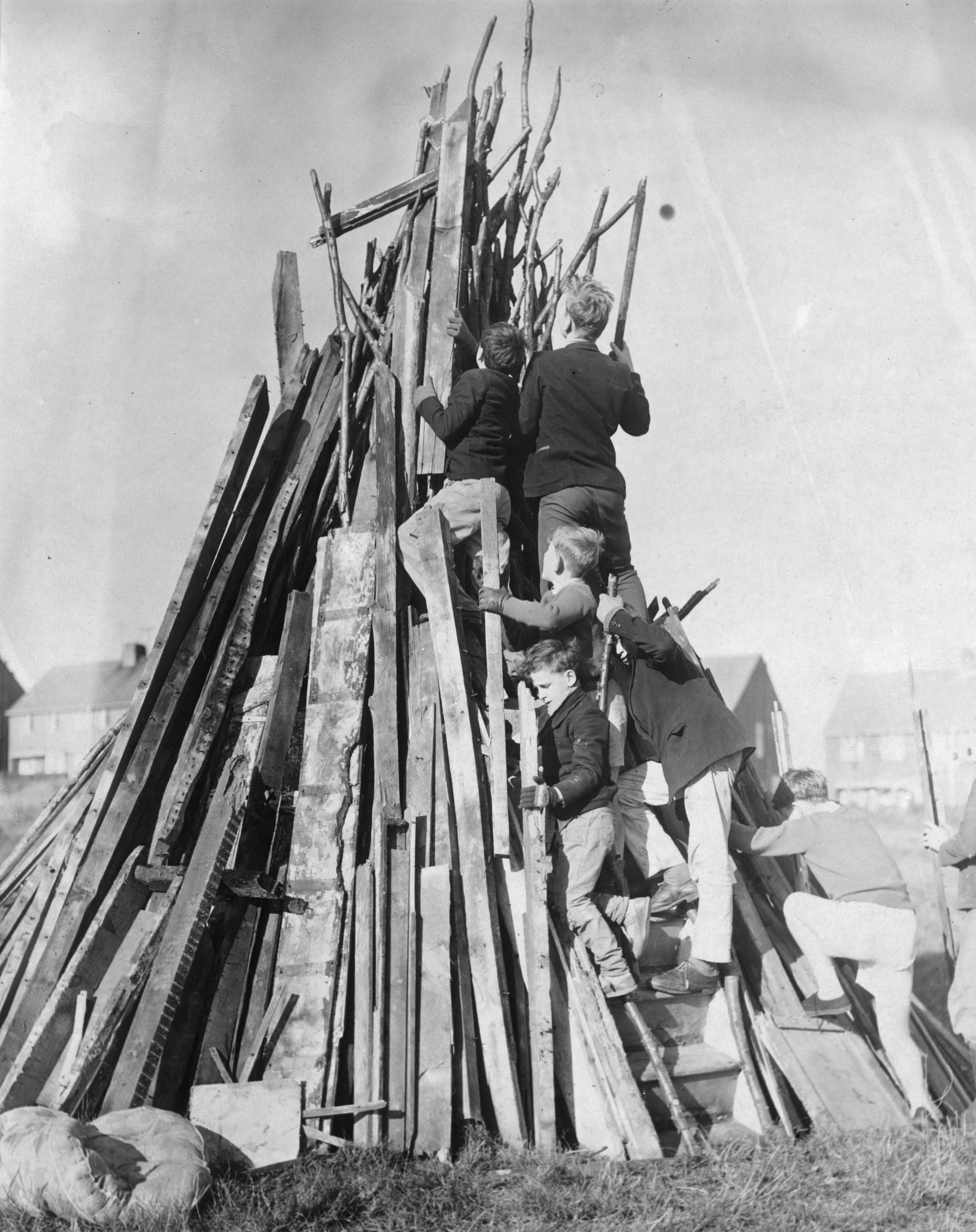 Children building a bonfire on the downs in Lewes in preparation for the festivities