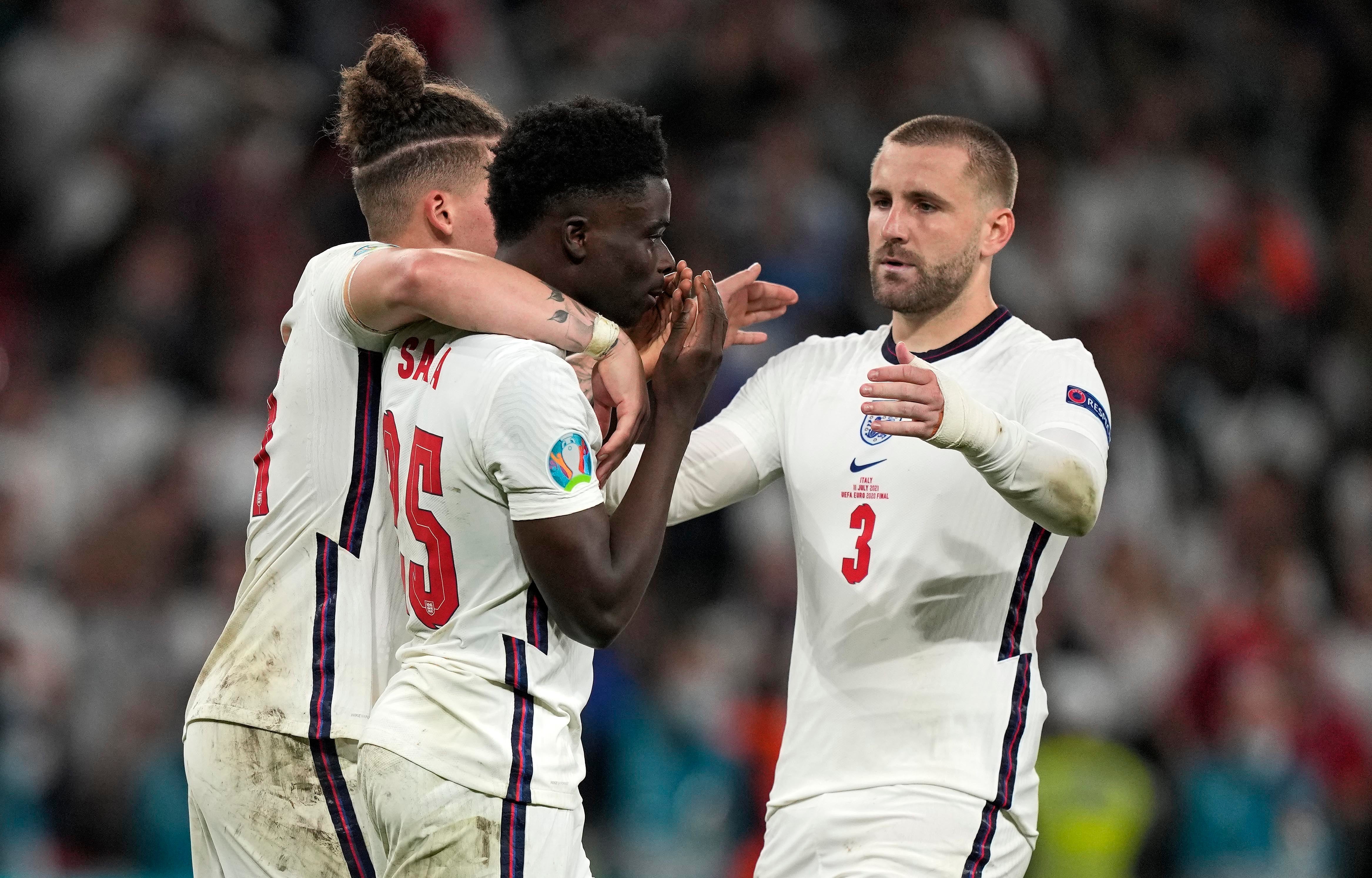 Footballer Bukayo Saka (centre) was one of three England players who received racist abuse after missing a penalty during the Euro 2020 final against Italy