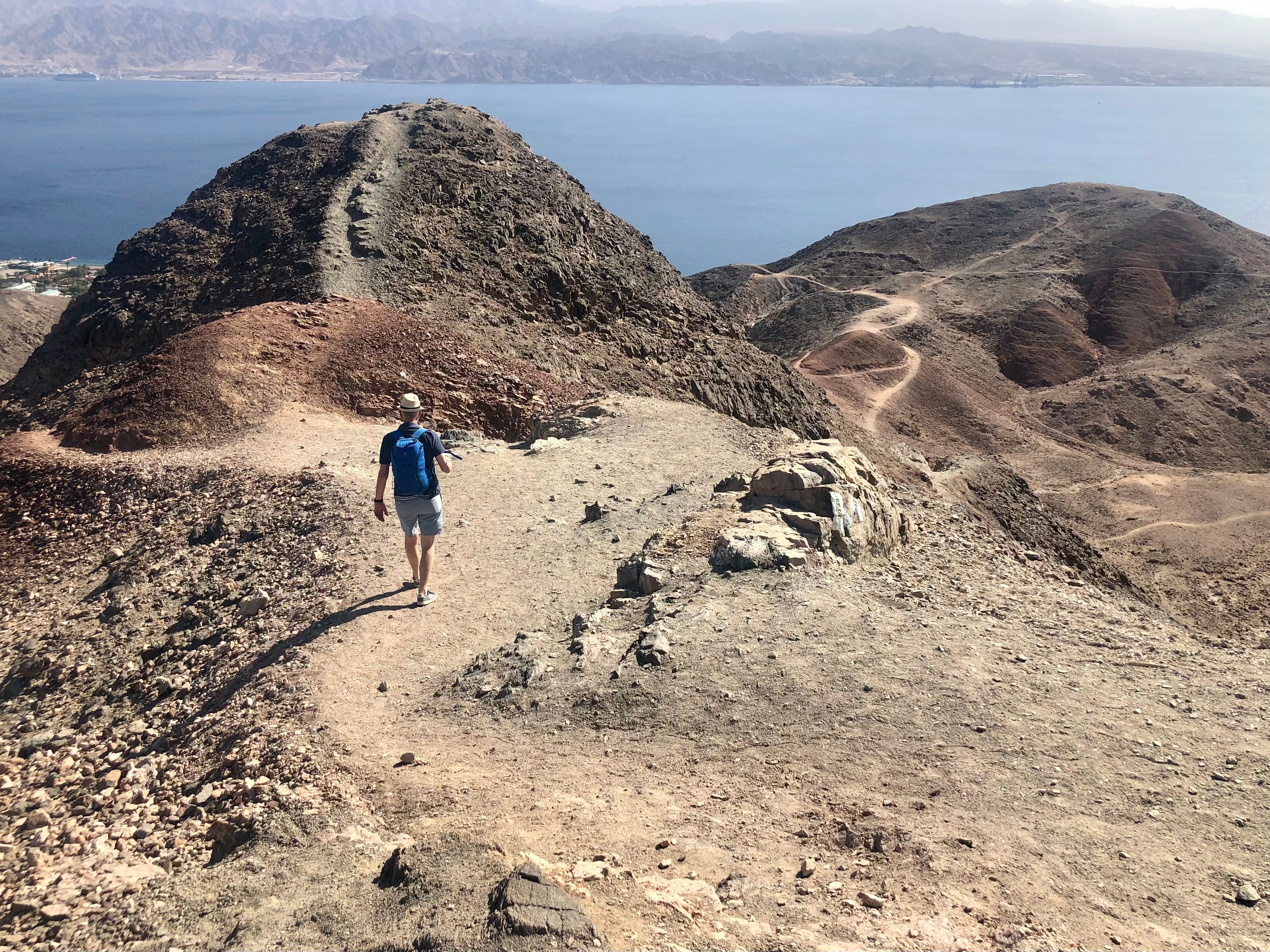 Out of reach? A hiker in the Sinai desert overlooking the Gulf of Aqaba