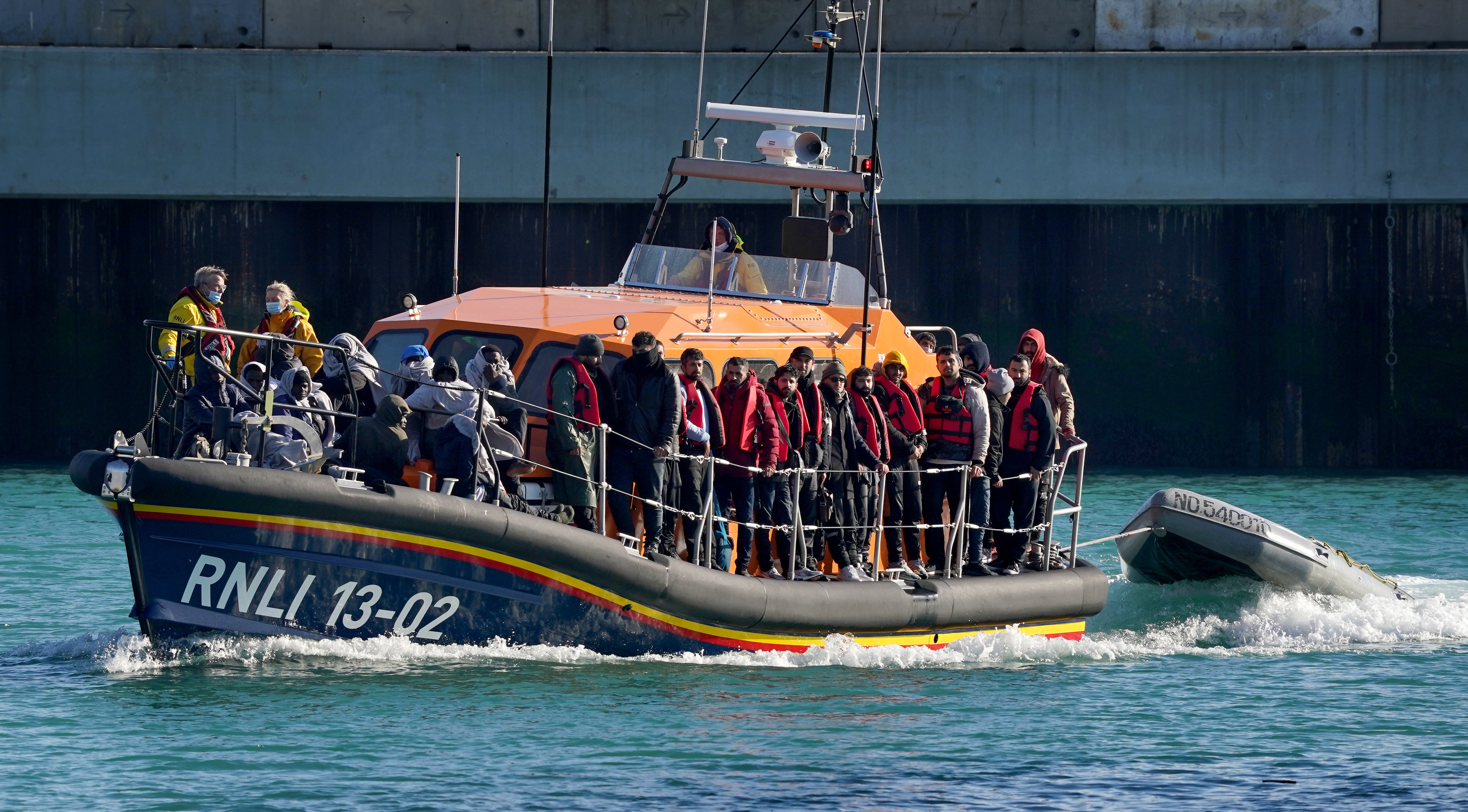 A group of people thought to be migrants are brought in to Dover, Kent on Wednesday, onboard the Dungeness Lifeboat following a small boat incident in the Channel.