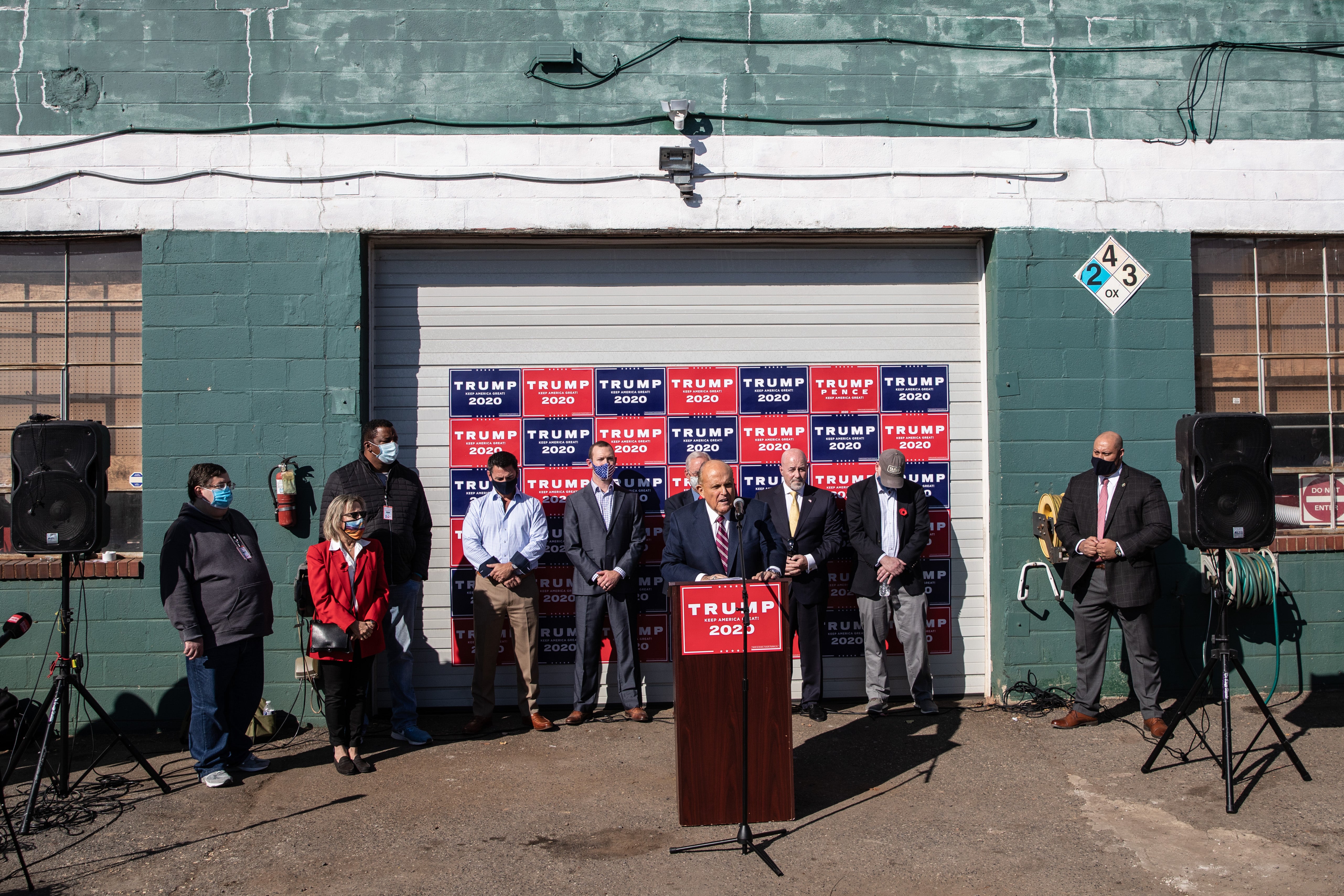 Rudy Giuliani hosts a press conference in the car park of the Four Seasons Total Landscaping in 2020