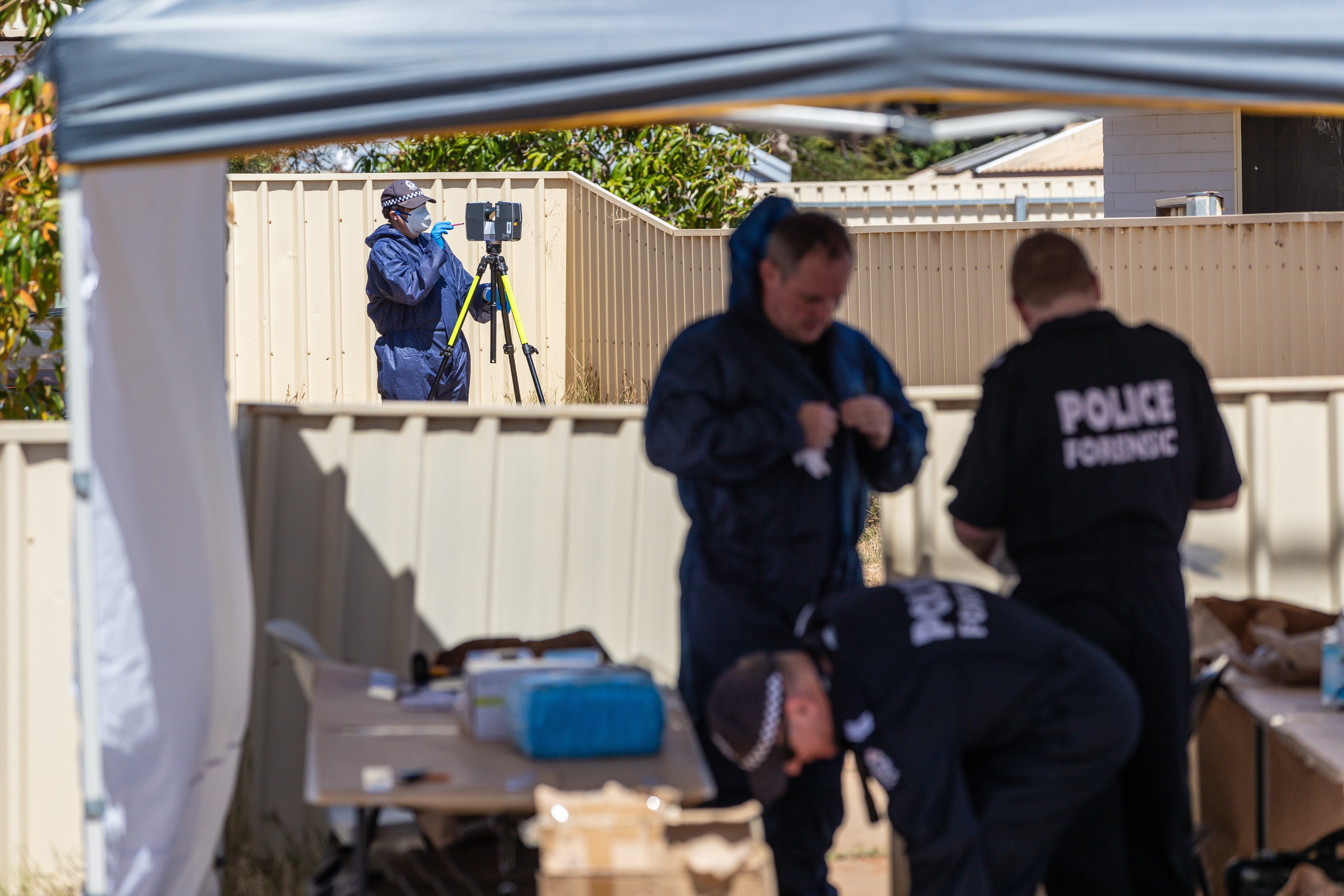 Forensic officers prepare to gather evidence