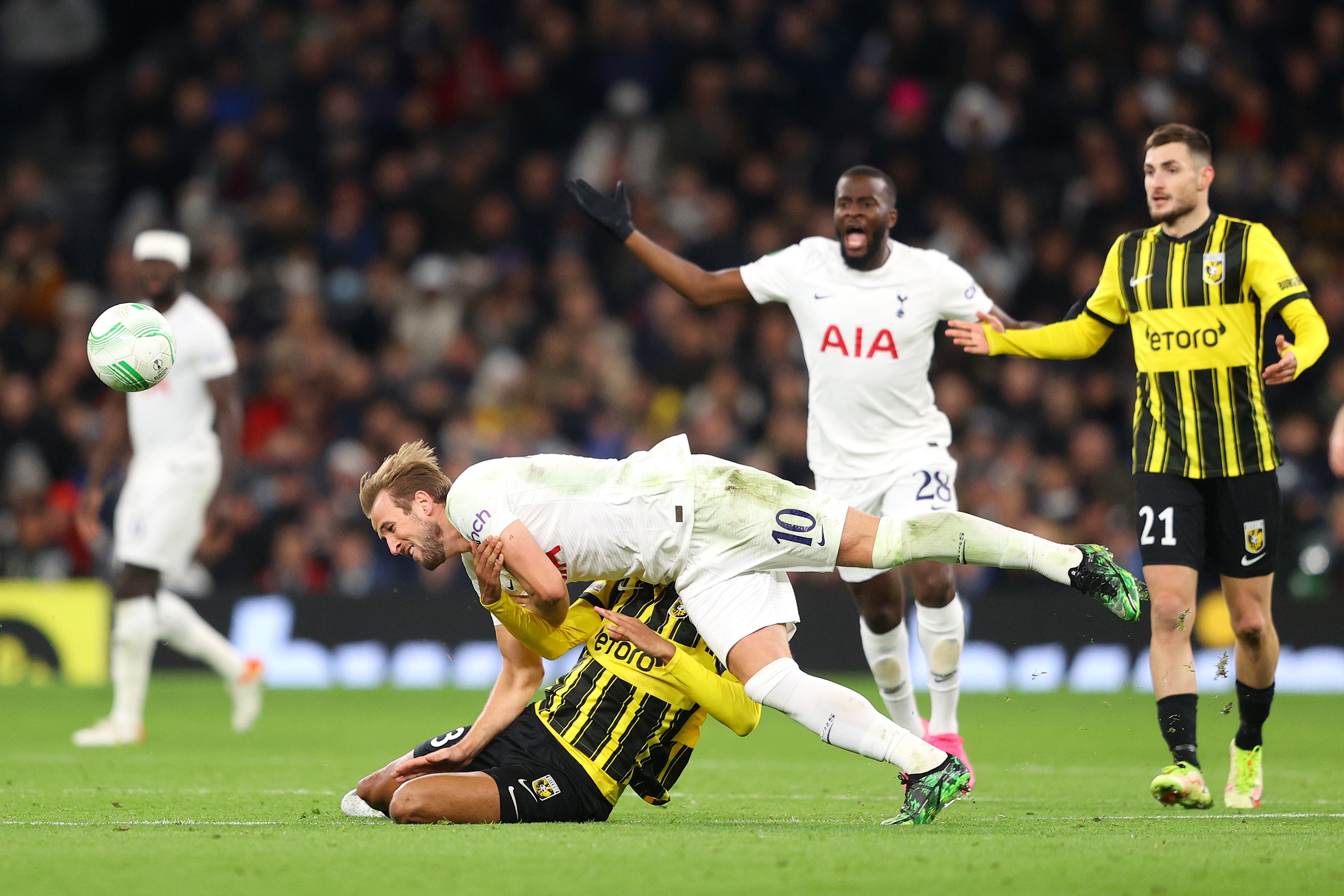 Danilho Doekhi hauls down Harry Kane to receive a second yellow card