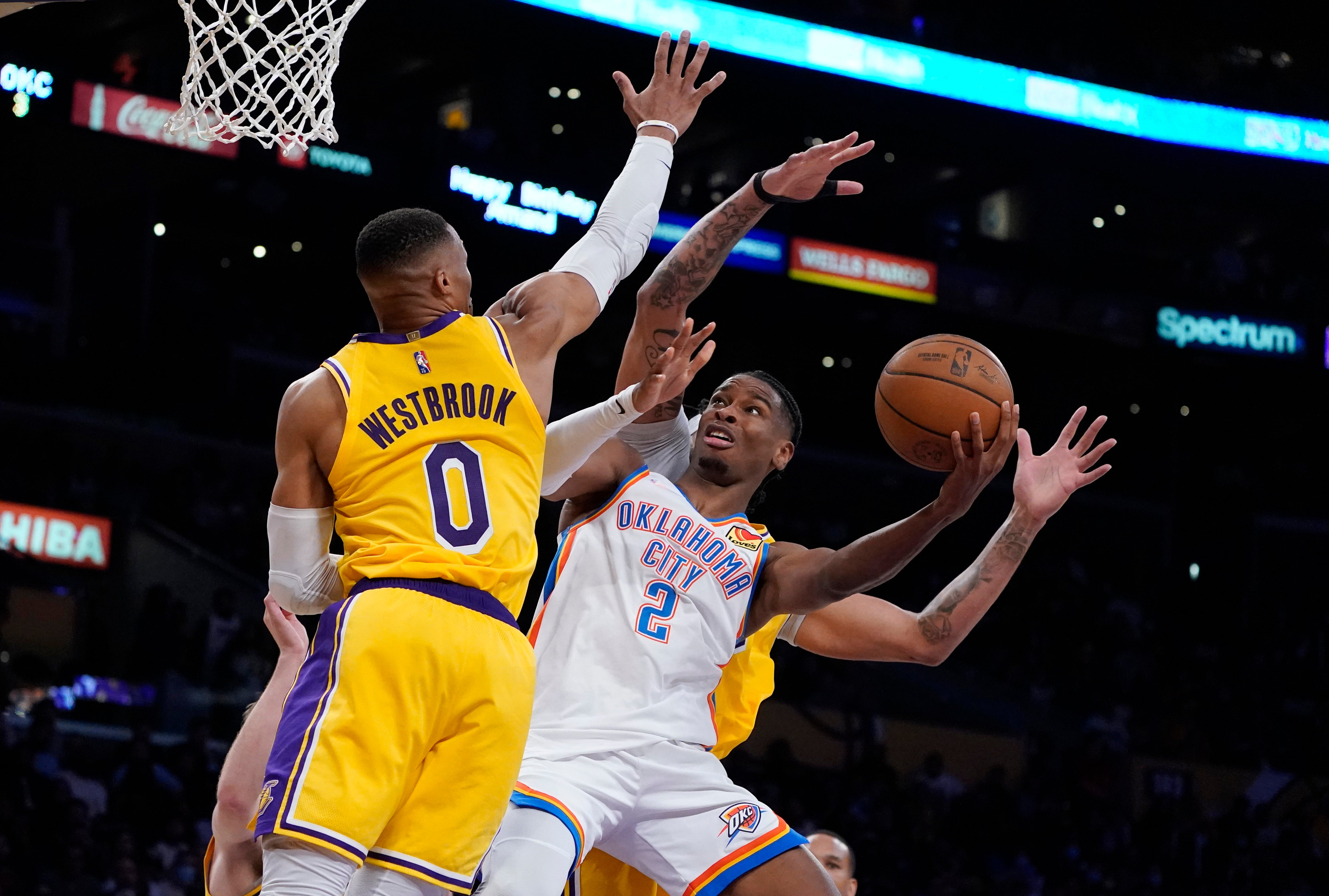 Oklahoma City Thunder guard Shai Gilgeous-Alexander (2) shoots over Los Angeles Lakers guard Russell Westbrook (0) (Marcio Jose Sanchez/AP)