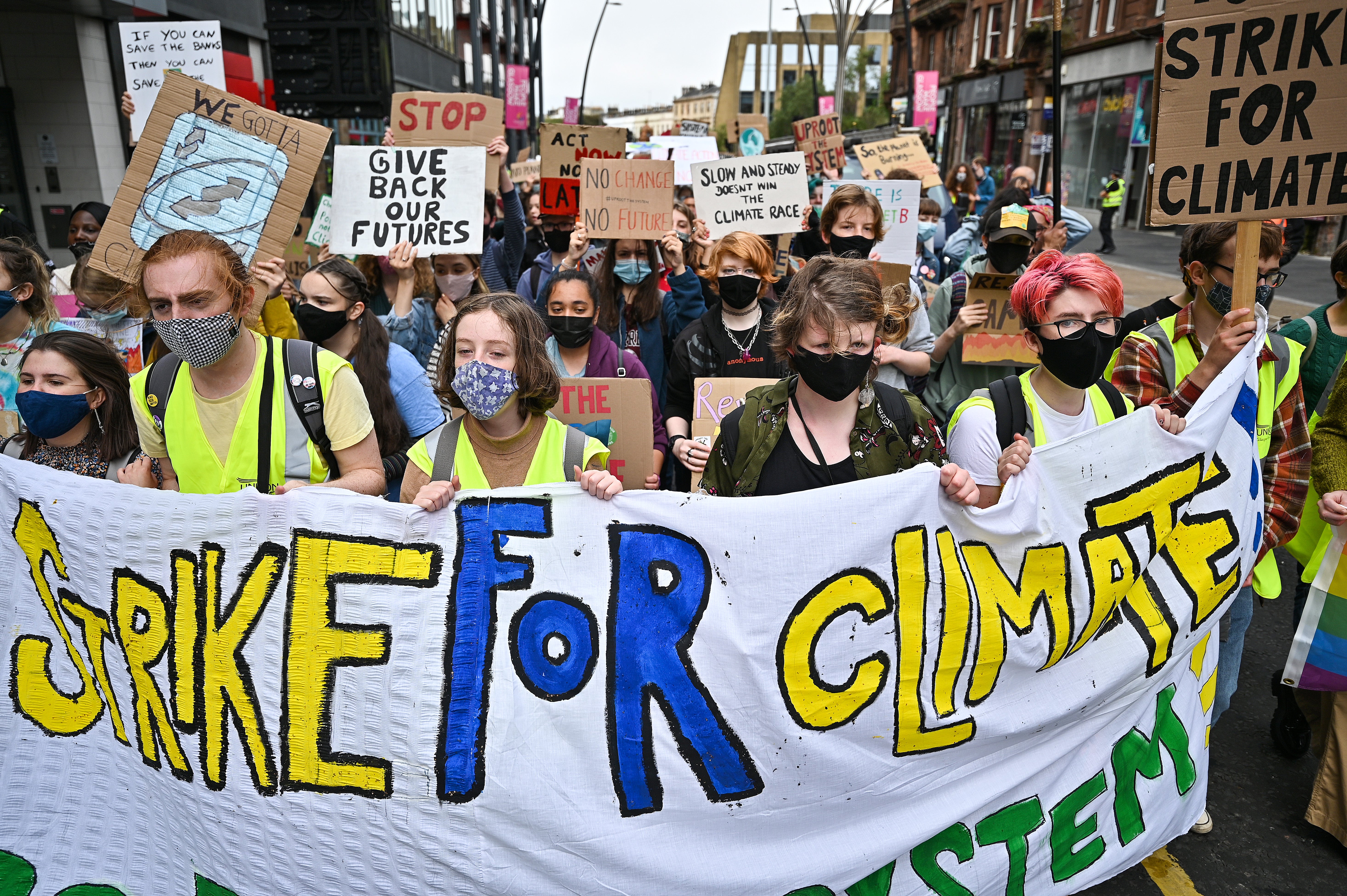 School children take part in a climate strike popularised by Swedish activist Greta Thunberg on September 24, 2021 in Glasgow, Scotland.