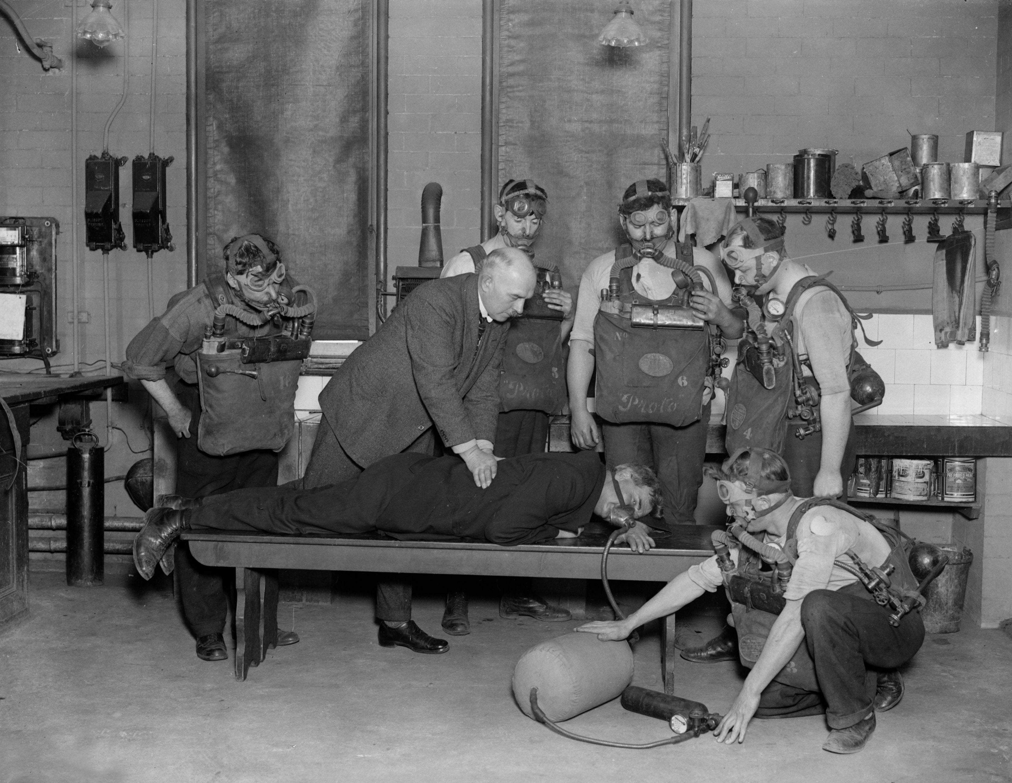 Rescue workers at Wheatley in Yorkshire practise artificial respiration and resuscitation techniques for an asphyxiated miner in 1925