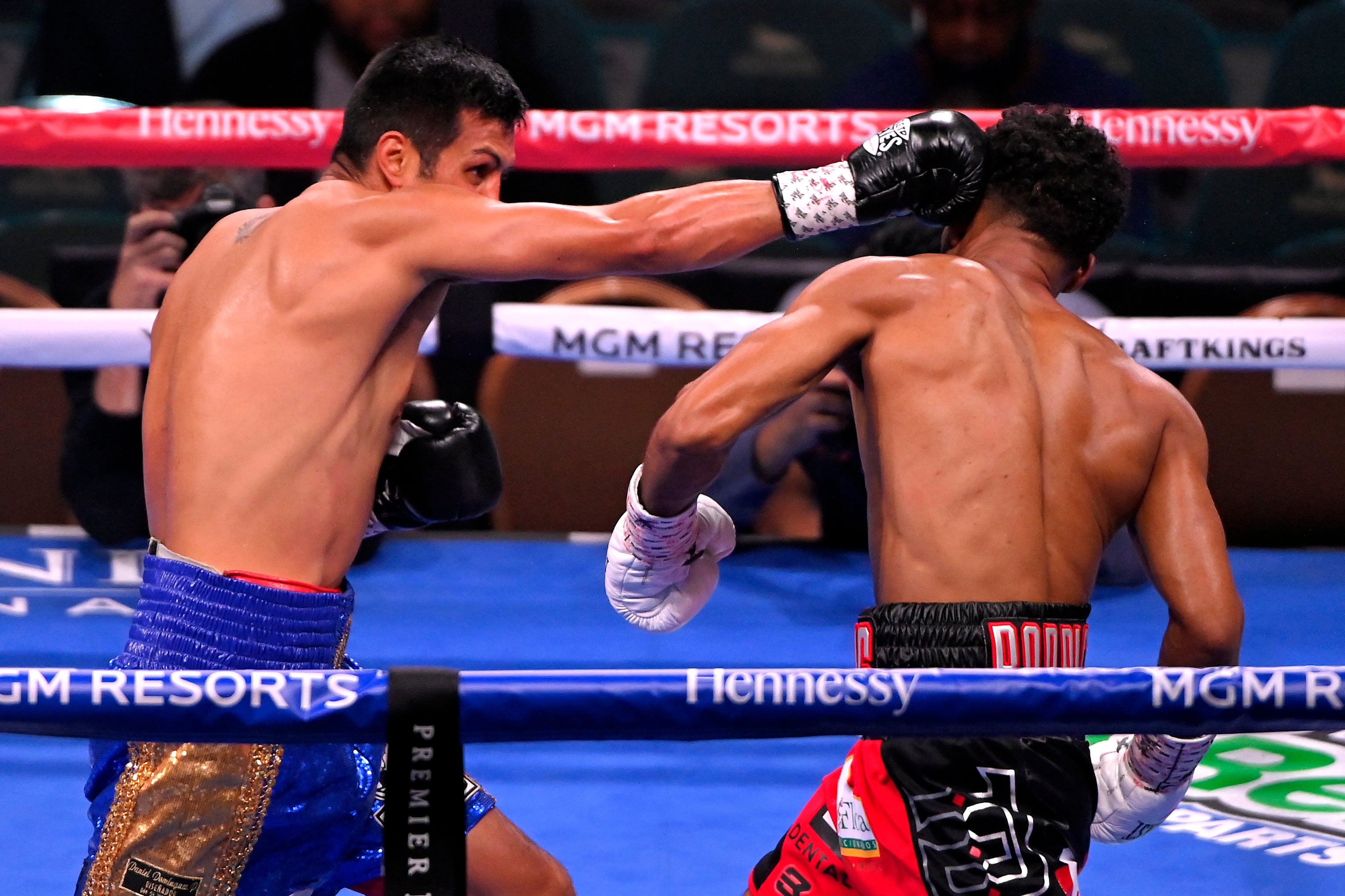 Pablo Romero (L) punches Elvis Rodriguez