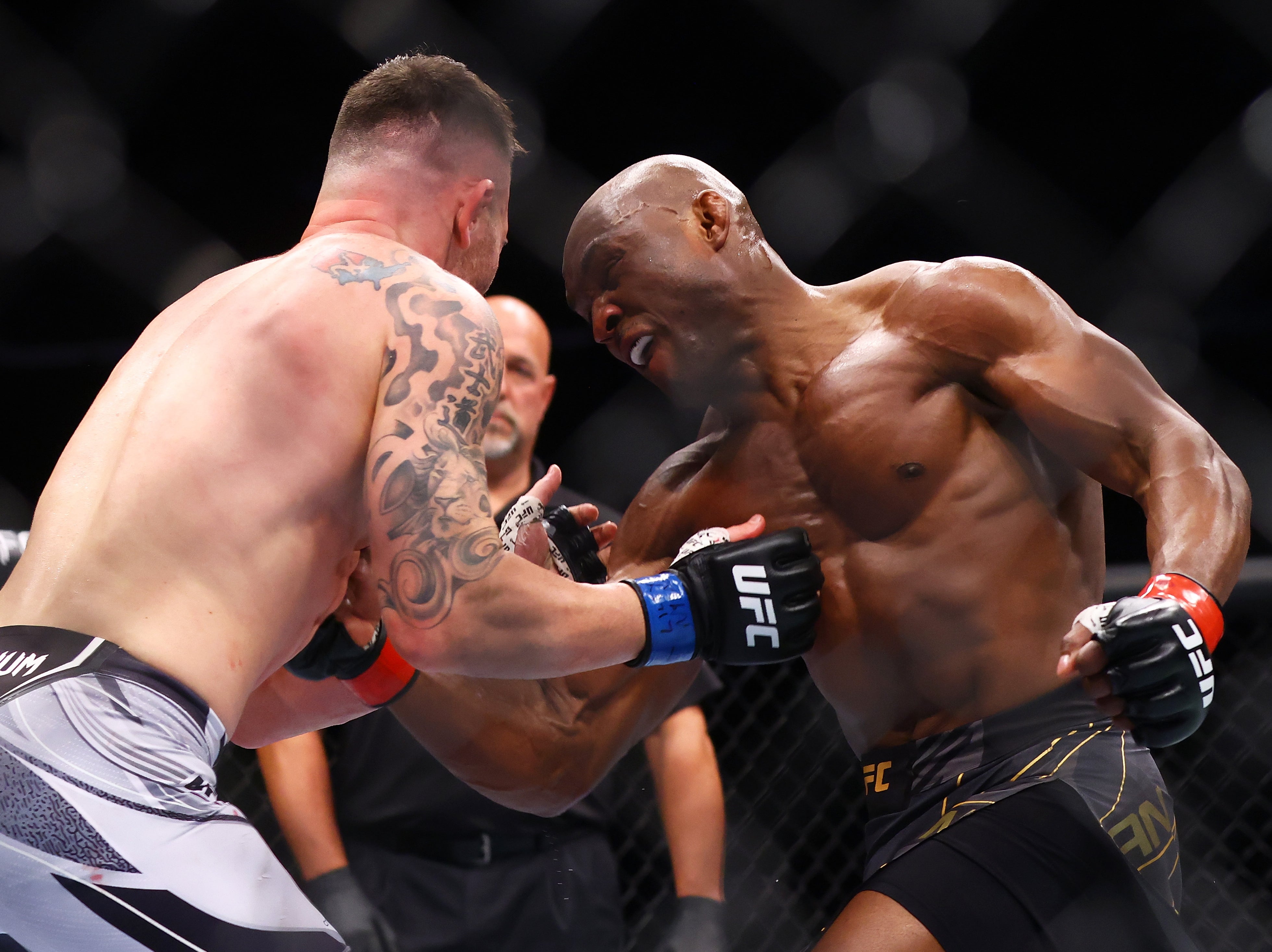 Kamaru Usman (right) retained his title against Colby Covington last time out