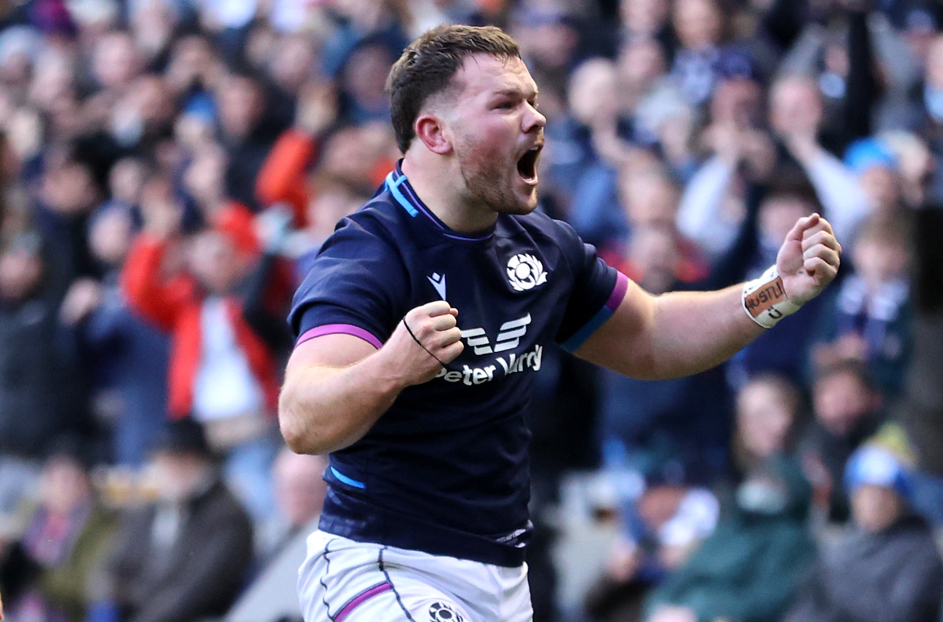 Scotland’s Ewan Ashman celebrates his debut try