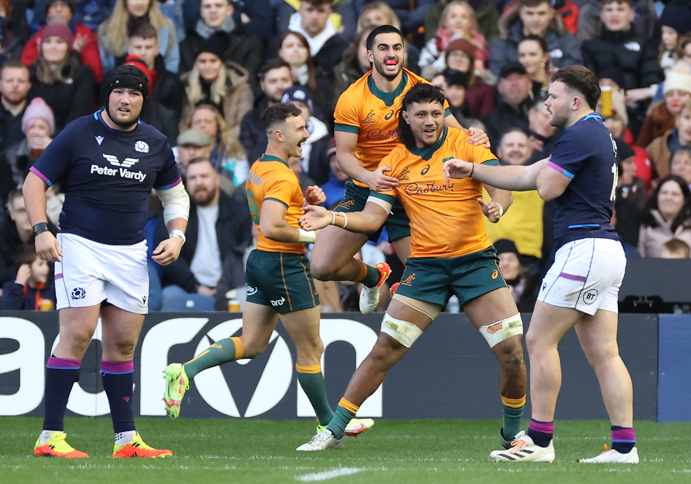 Rob Leota (centre) was on the scoresheet for Australia