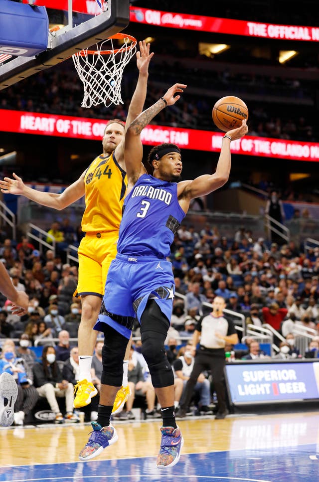 Orlando Magic forward Chuma Okeke (3) hauls in a rebound in front of Utah Jazz forward Bojan Bogdanovic (Jacob M Langston/AP)