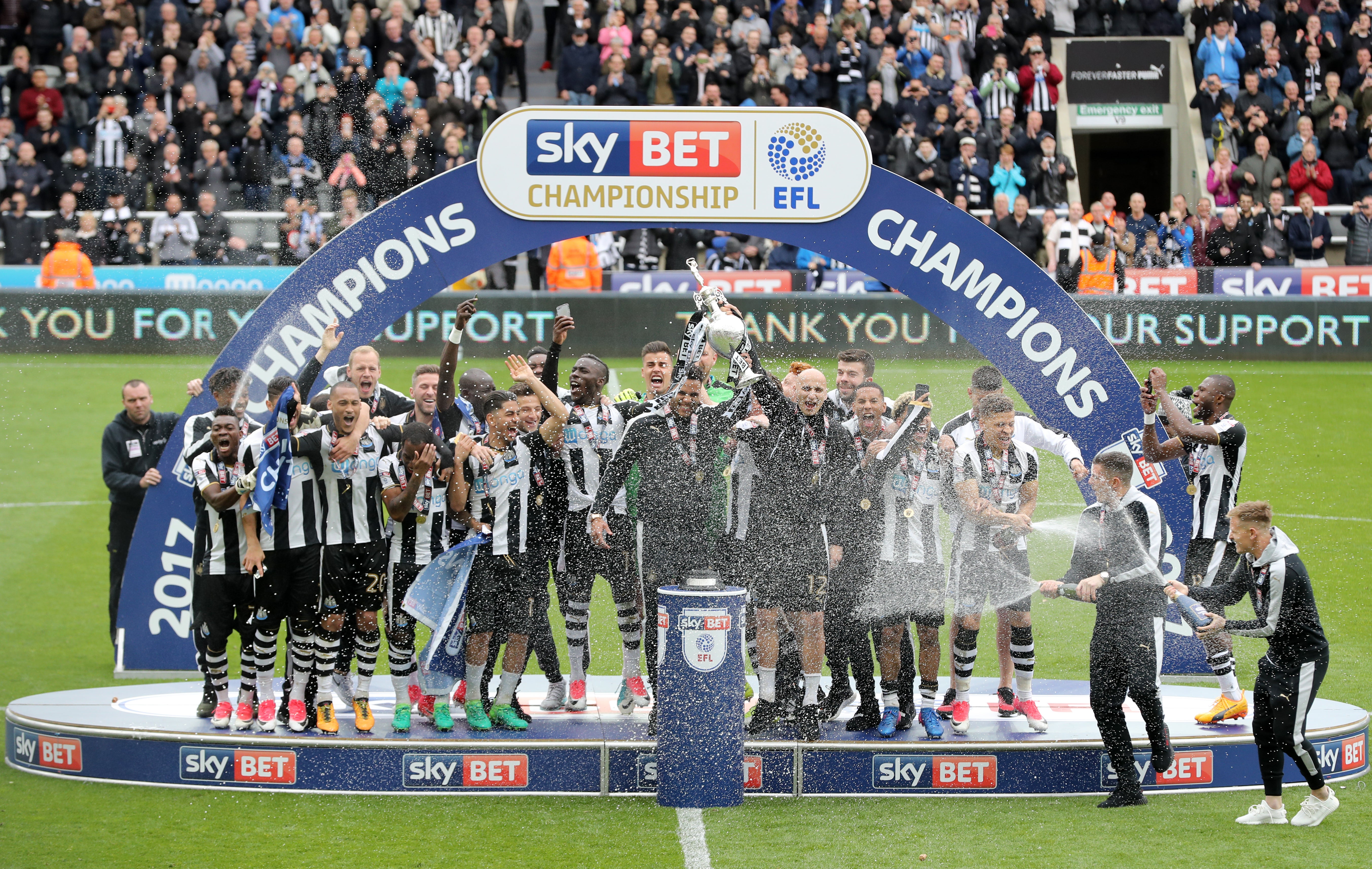 Newcastle celebrate with the Sky Bet Championship trophy after winning promotion back to the Premier League in 2017 (Owen Humphreys/PA)