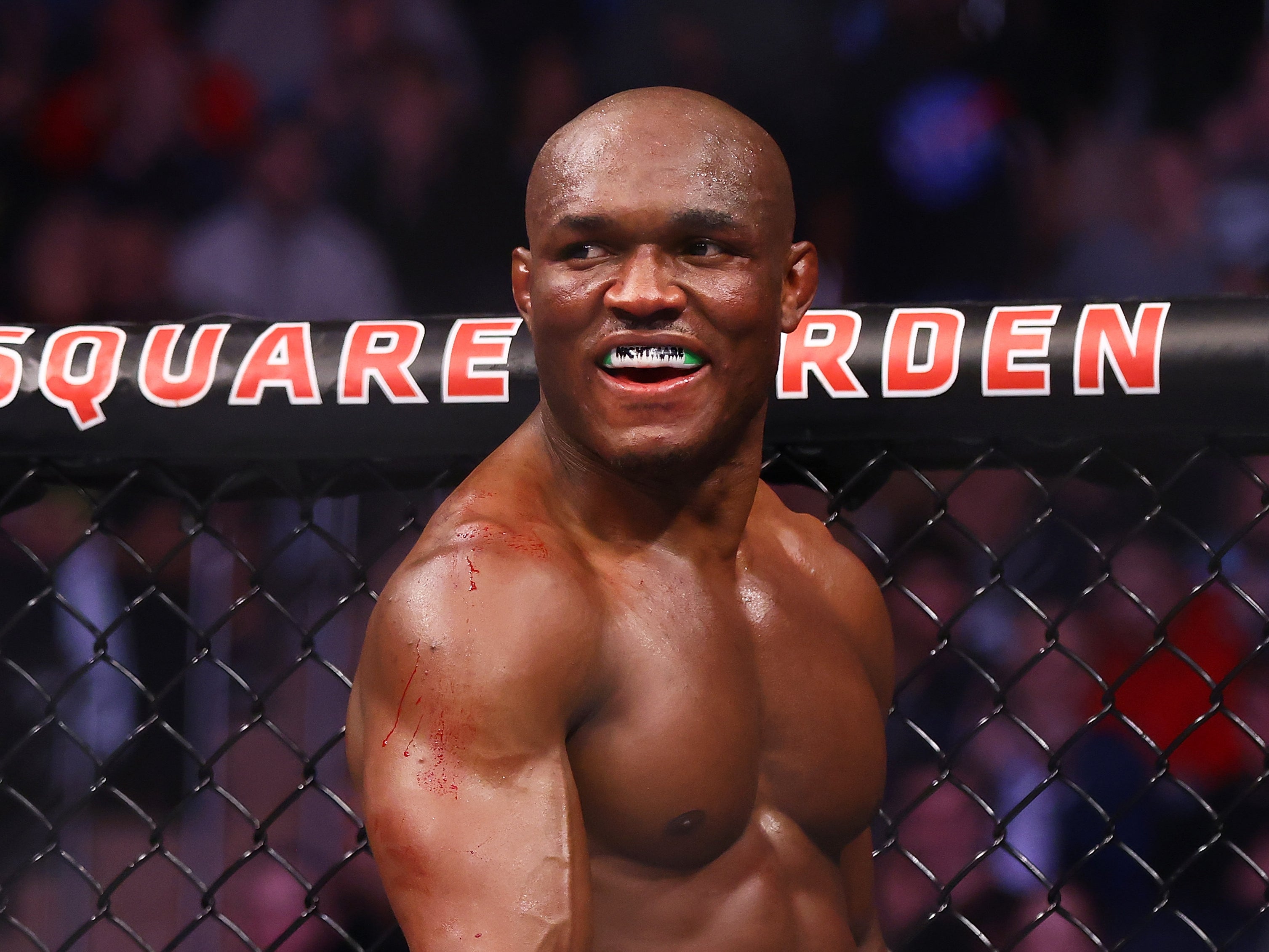 Kamaru Usman smiles against Colby Covington at UFC 268