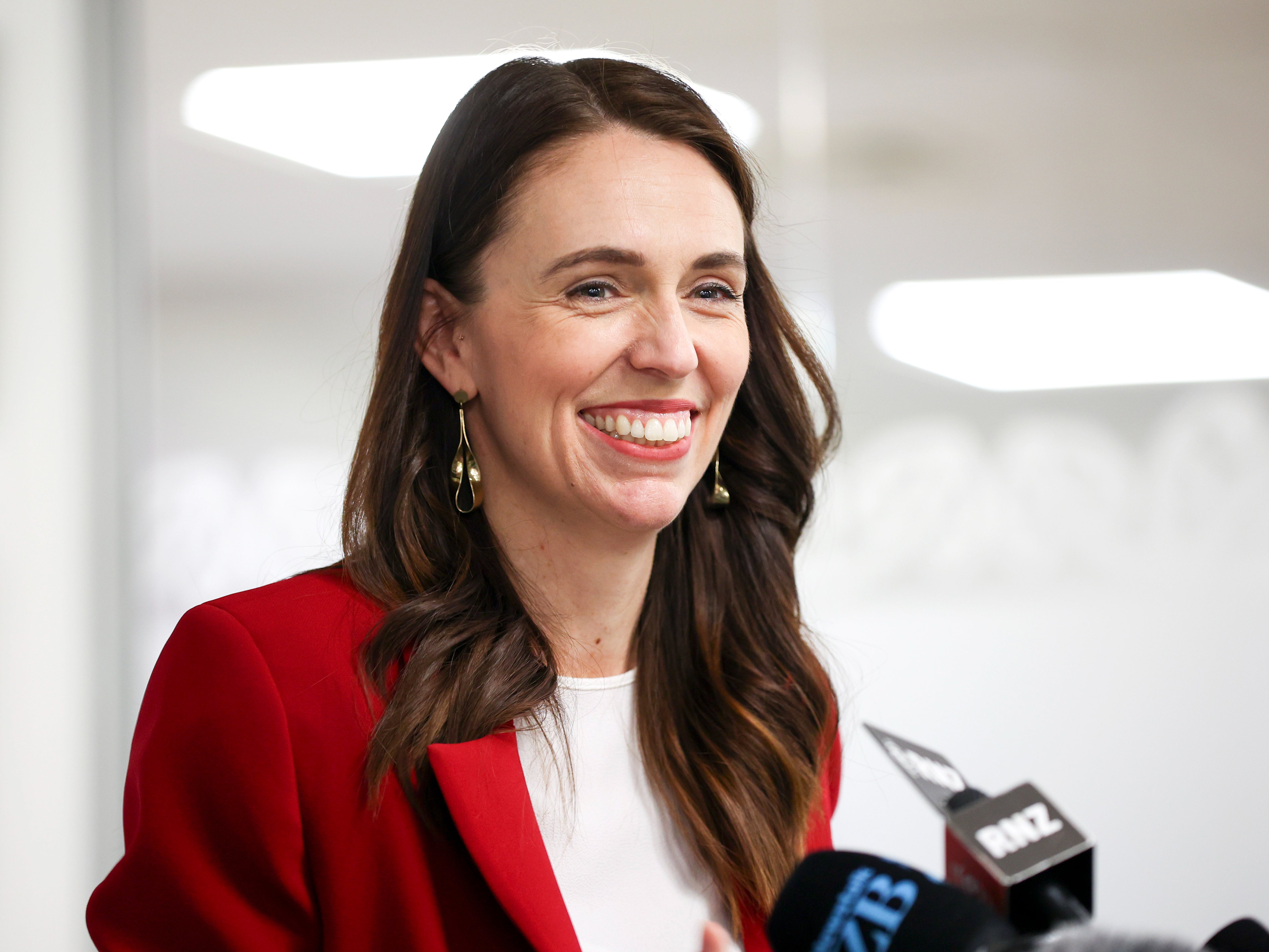 PM Jacinda Ardern says New Zealand will face new restrictions after nine Omicron cases were detected in family that flew to Auckland for a wedding