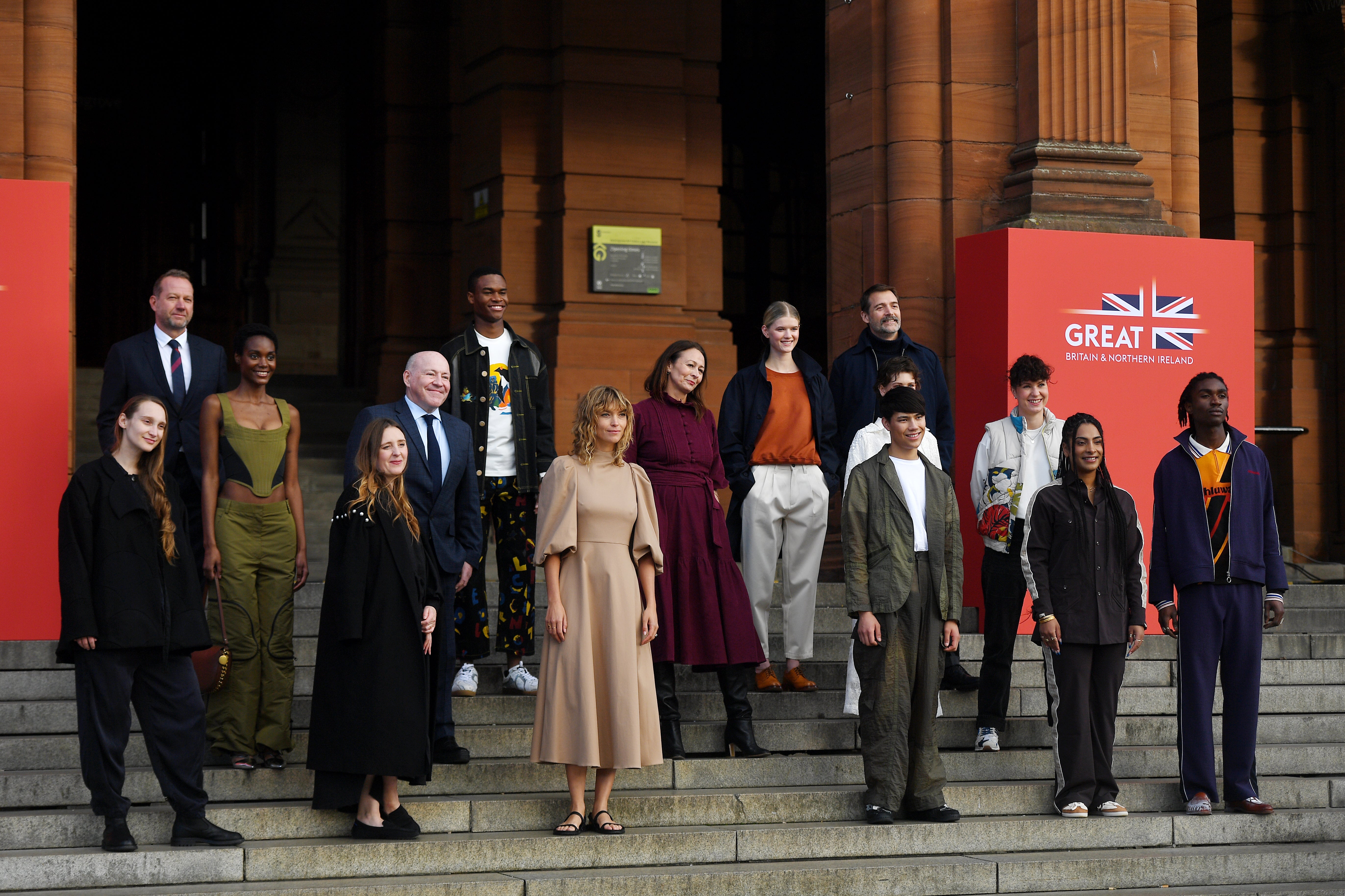 Designers and models pose outside Kelvingrove Art Gallery and Museum during the GREAT Fashion For Climate Action event