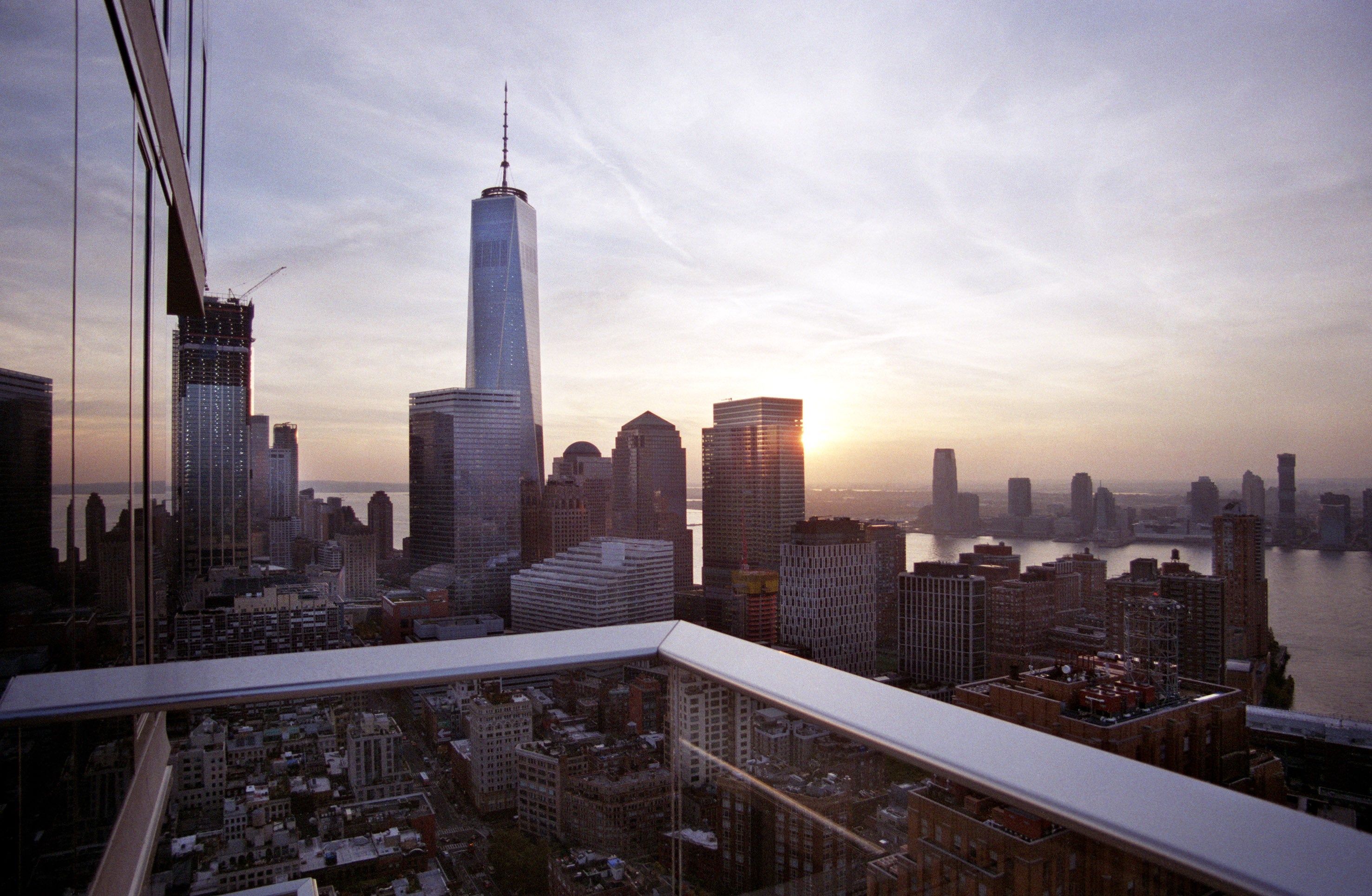 Southern and western sunset views of One World Trade Center, the Hudson River and New Jersey from one of the upper floor master bedroom terraces at Herzog & de Meuron’s 56 Leonard.