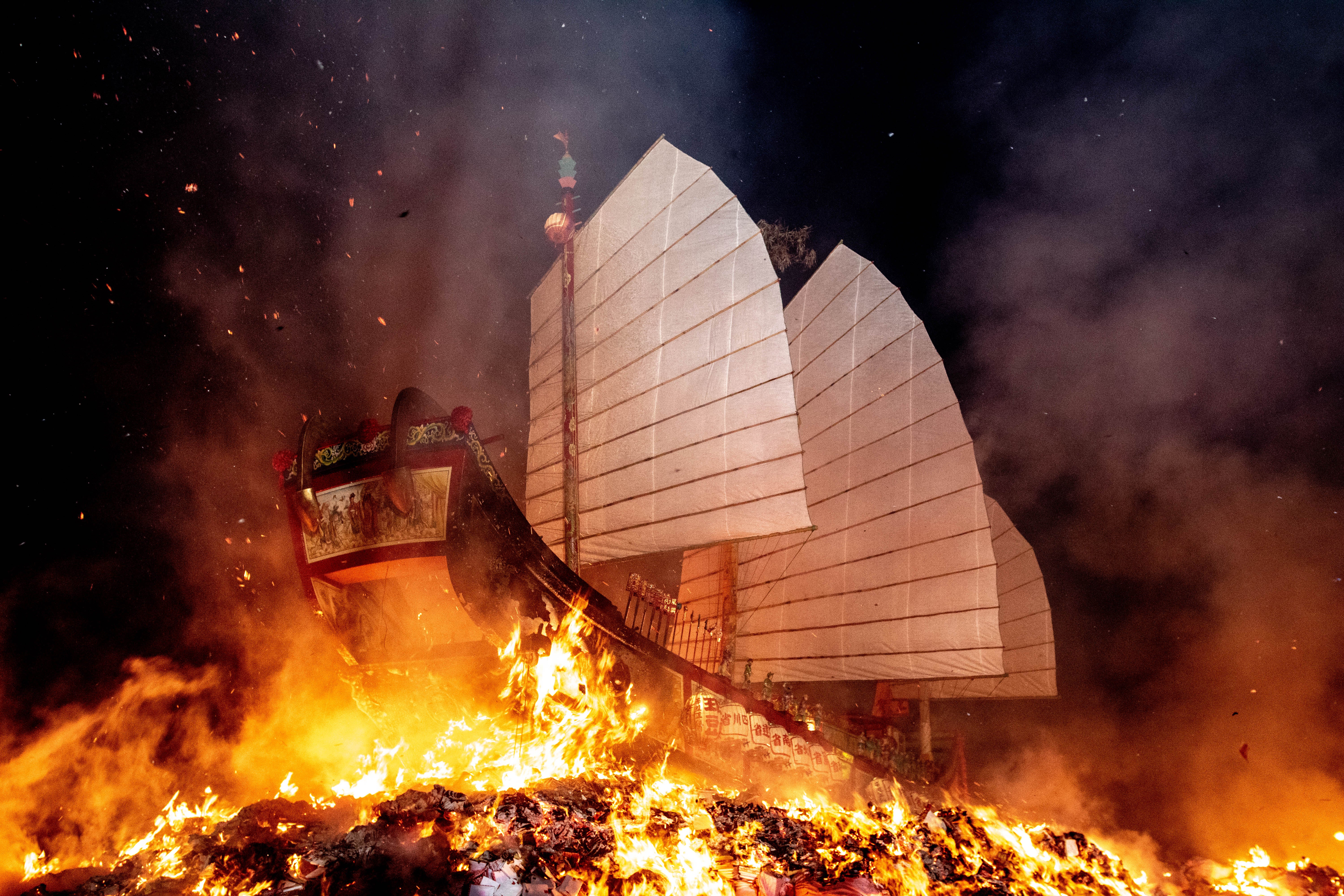 The Wang Ye boat erupts in flames just before dawn