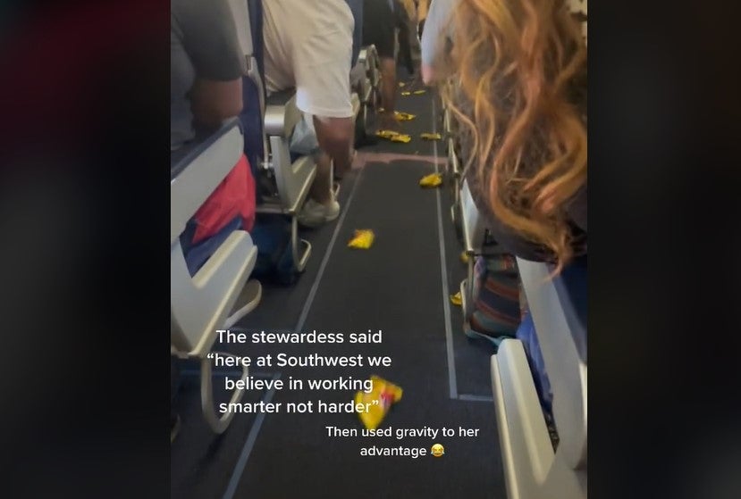 Inflight snacks being slid down the plane aisle