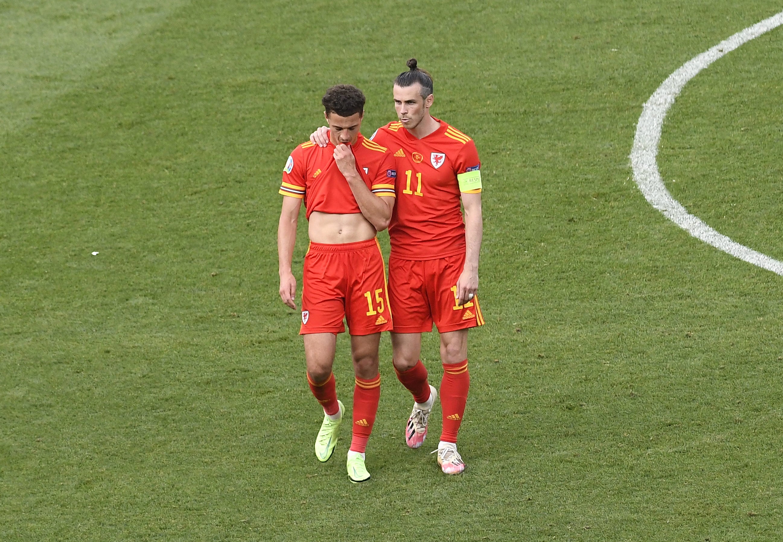 Ethan Ampadu (left) is consoled by Wales captain Gareth Bale after being sent off against Italy at Euro 2020 (Massimo Insabato/PA)