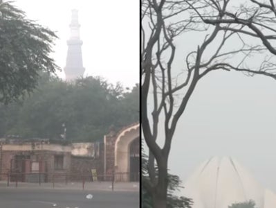 Qutab Minar and Lotus Temple wreathed in smog in Delhi on 12 November