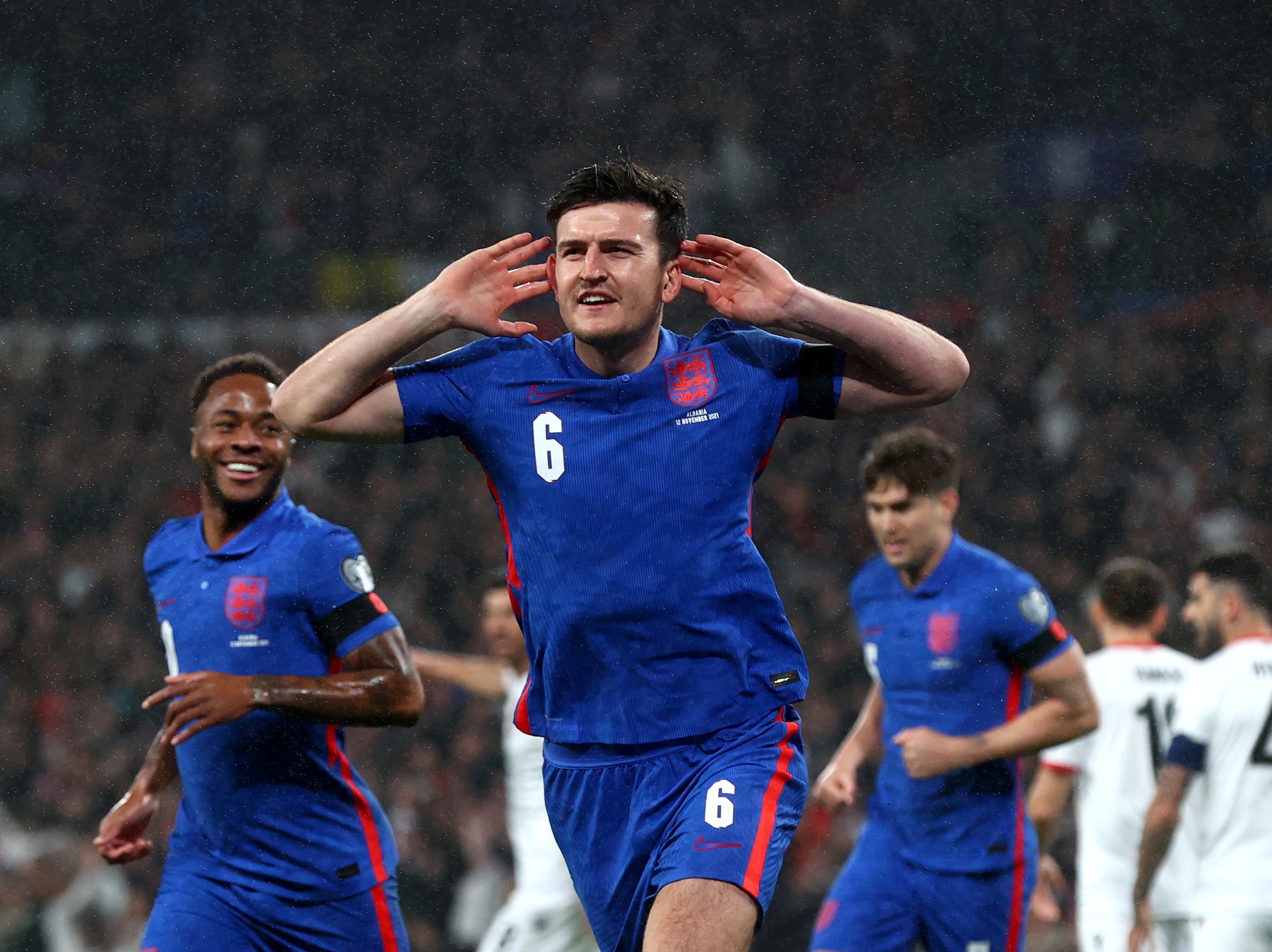 Harry Maguire celebrates opening the scoring for England against Albania