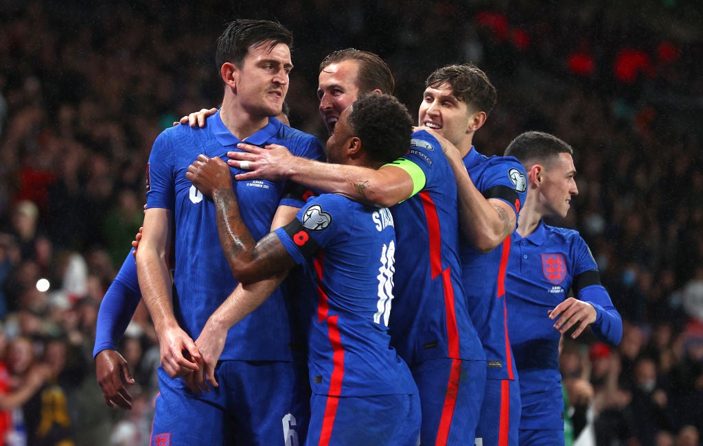 Harry Maguire celebrates scoring England’s opening goal against Albania on Friday