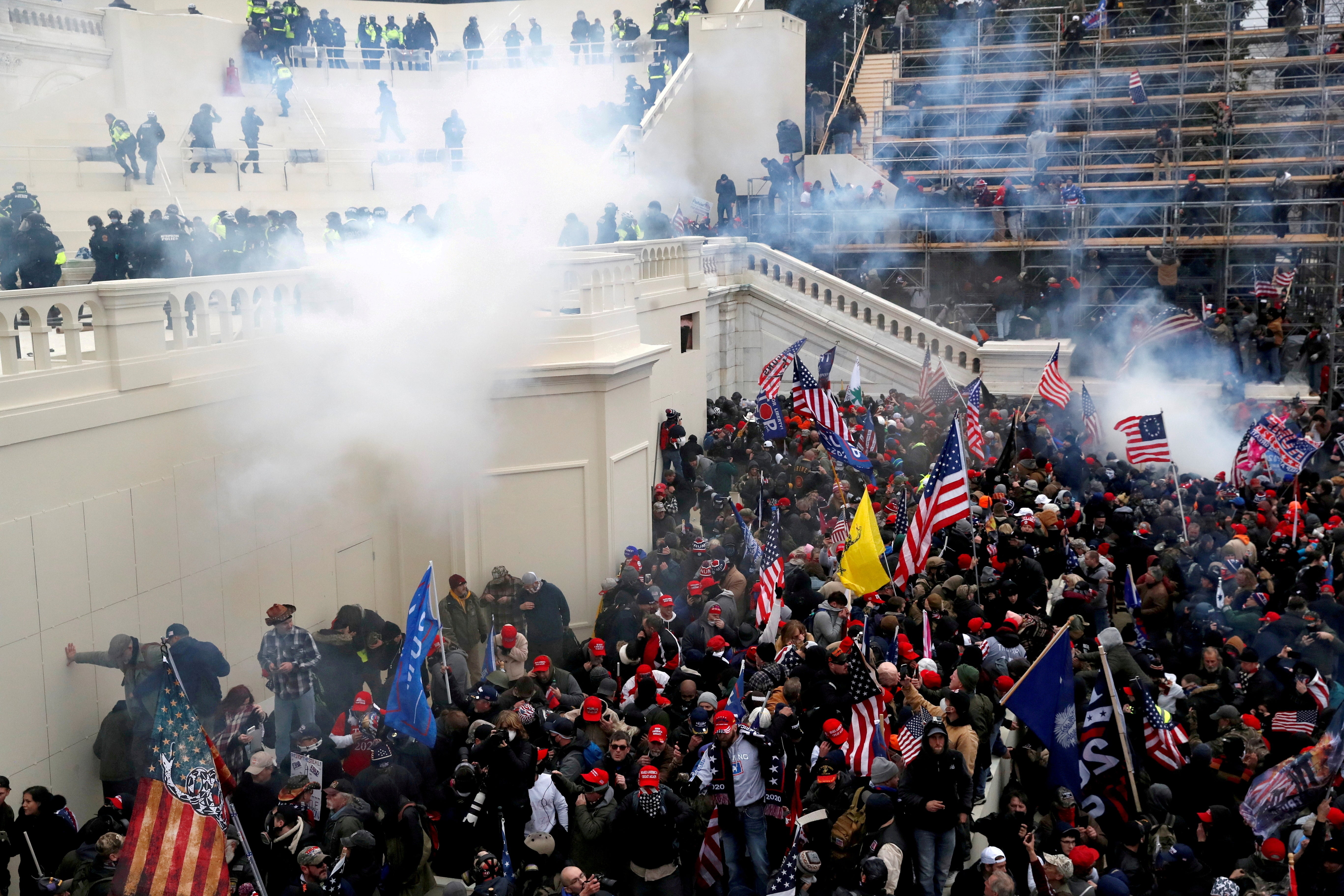 Donald Trump fans storm the US Capitol on January 6 in a riot that left five people dead