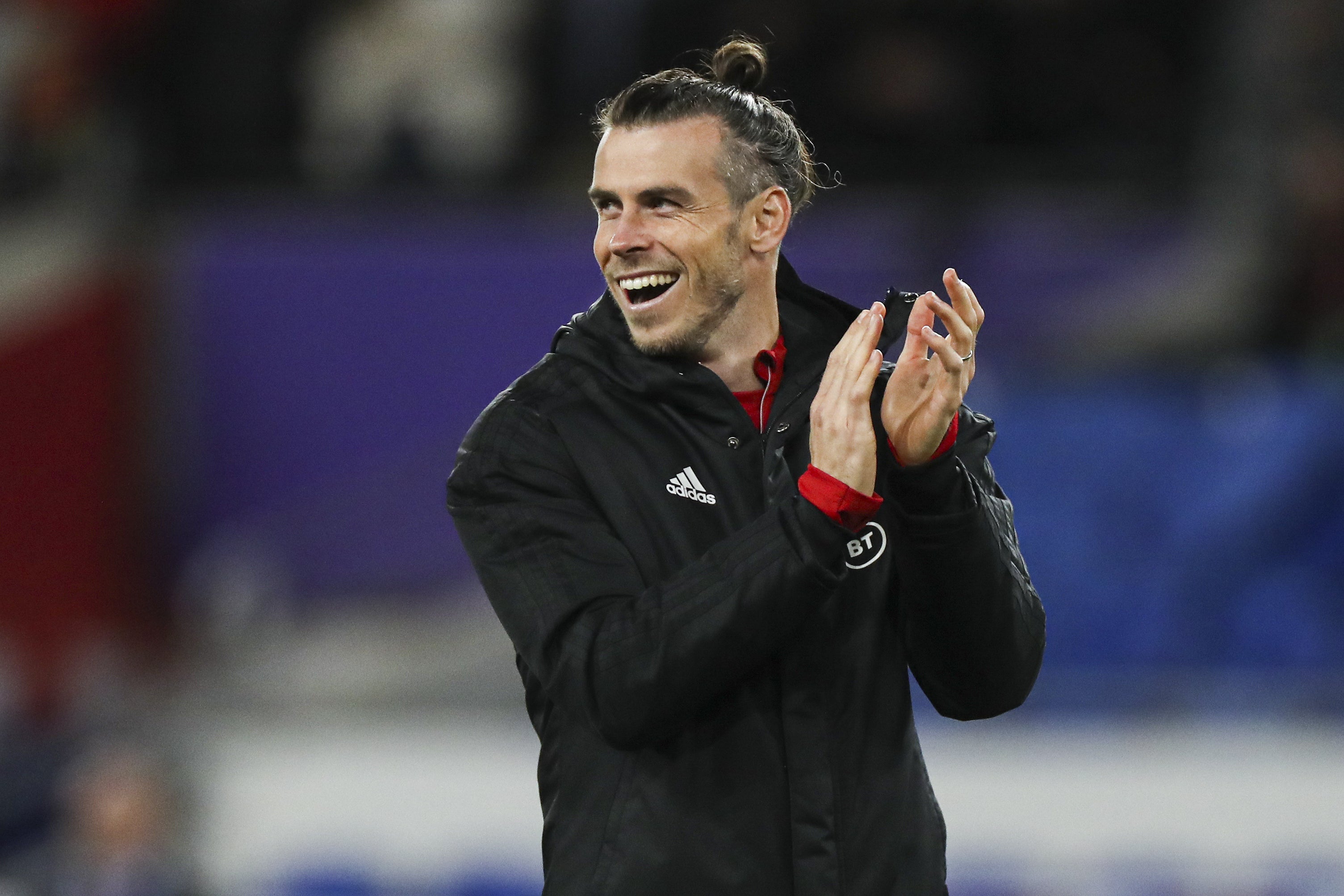 Gareth Bale smiles after earning his 100th Wales cap in their 5-1 World Cup qualifying victory over Belarus (Bradley Collyer/PA)