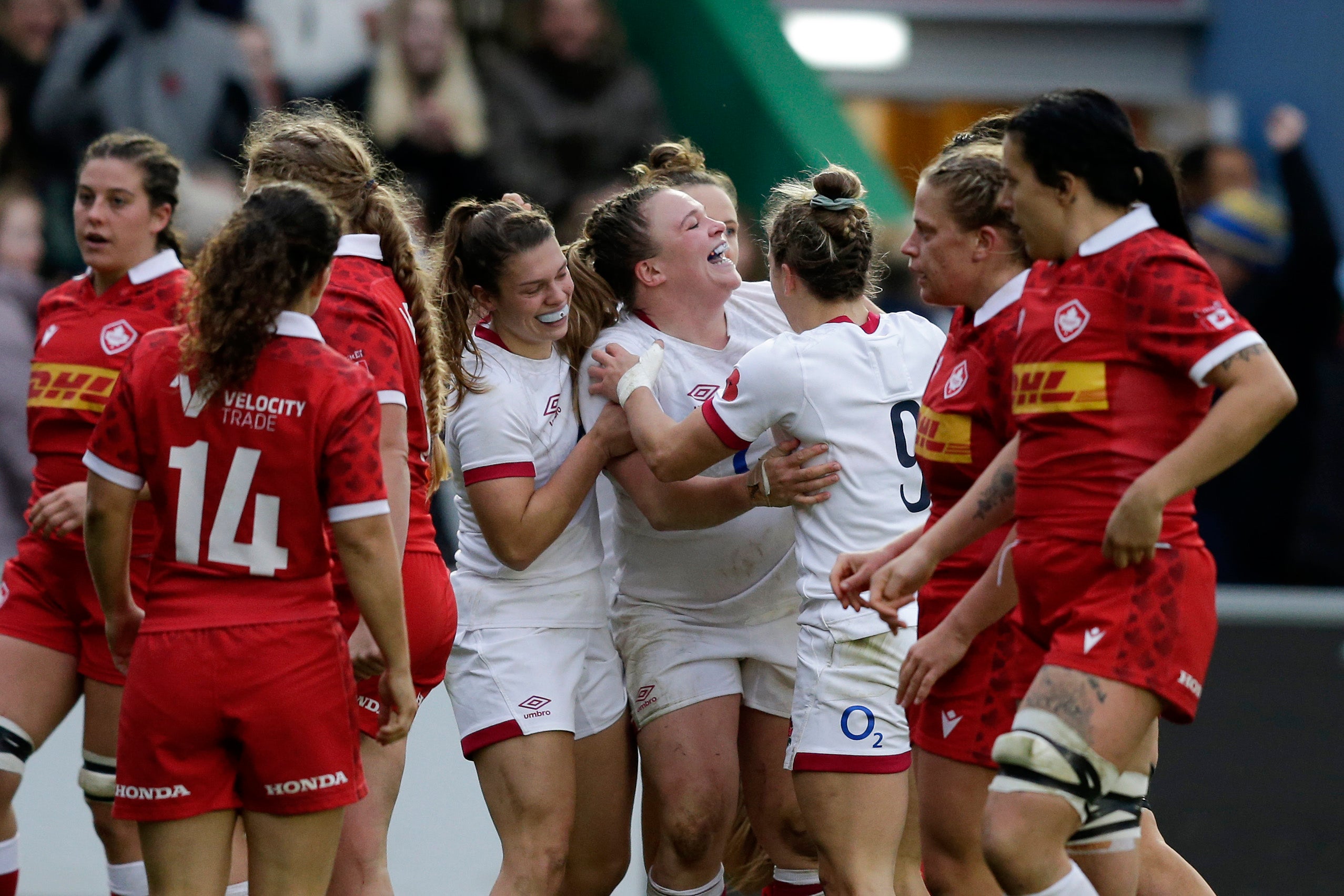 Sarah Bern celebrates with teammates after scoring their fourth try