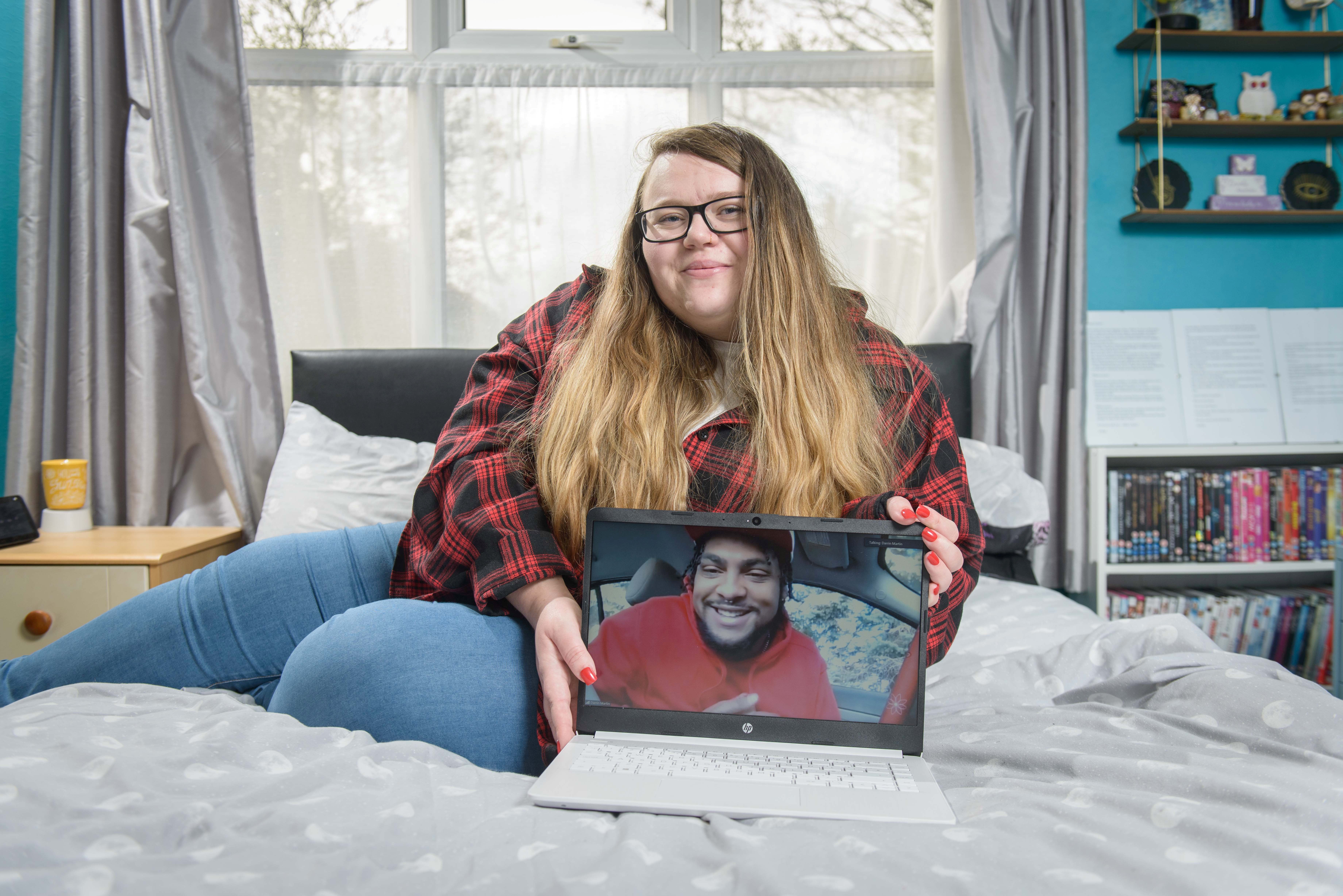 The newlyweds pictured together, with Darrin on a video call.