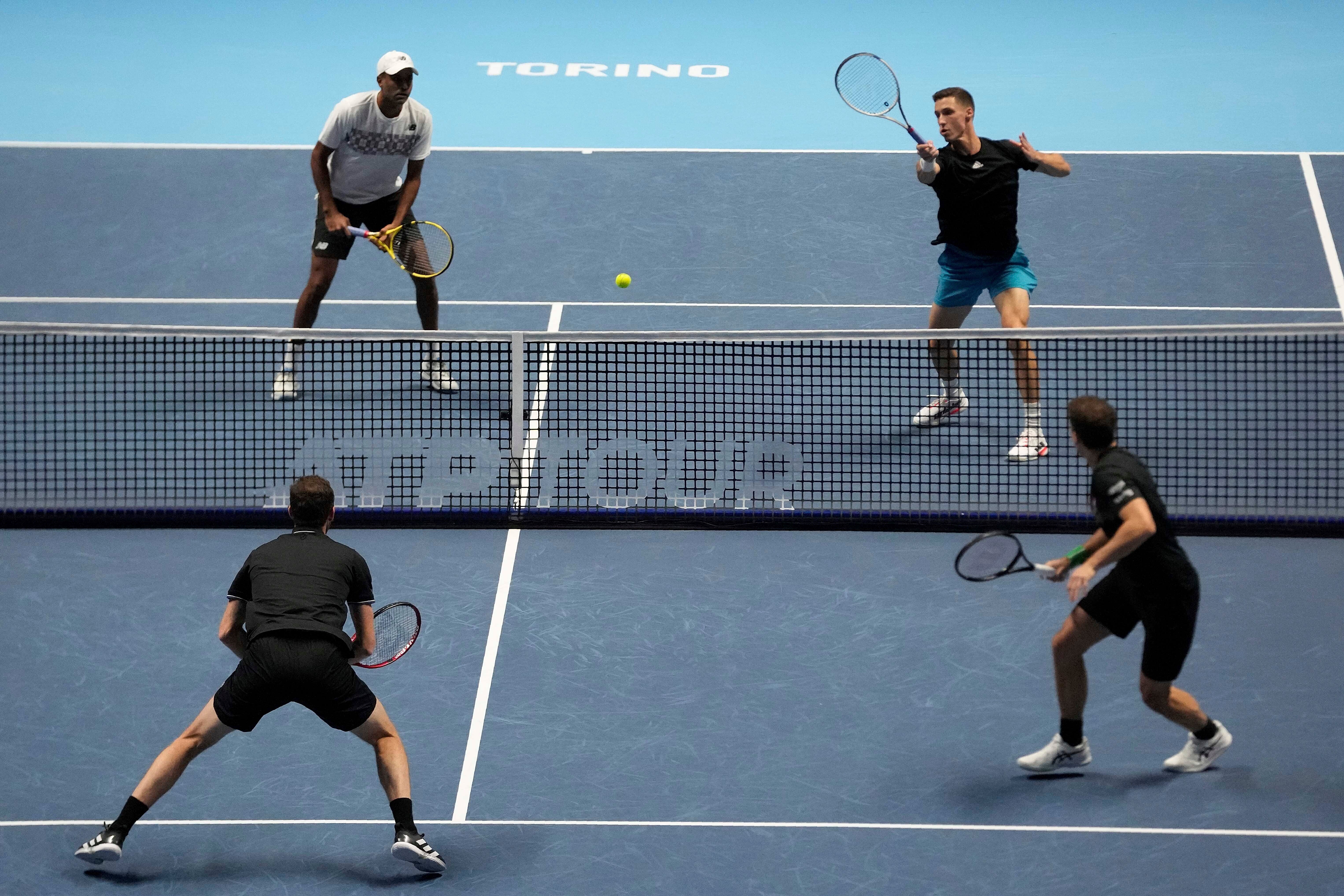 Rajeev Ram and Joe Salisbury (top) take on Jamie Murray and Bruno Soares (Luca Bruno/AP)