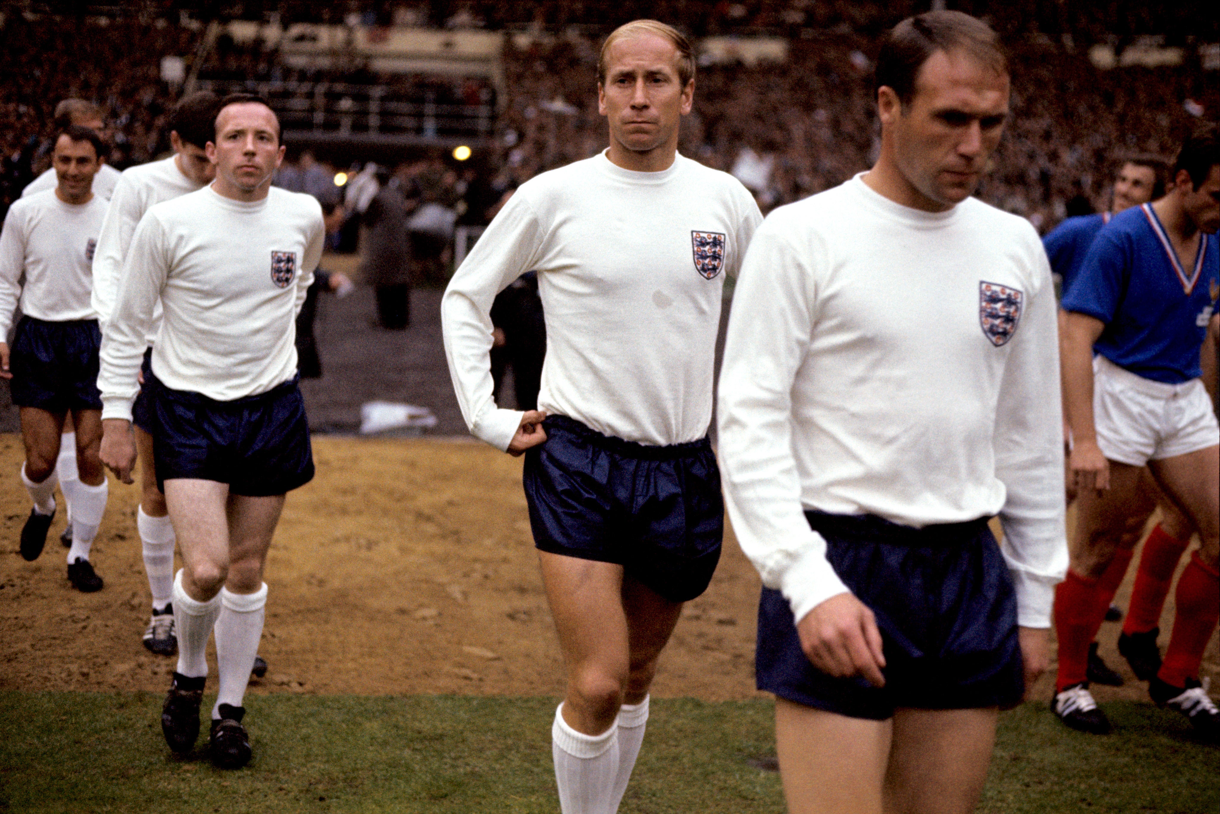 Sir Bobby (second right) scored 49 goals for England