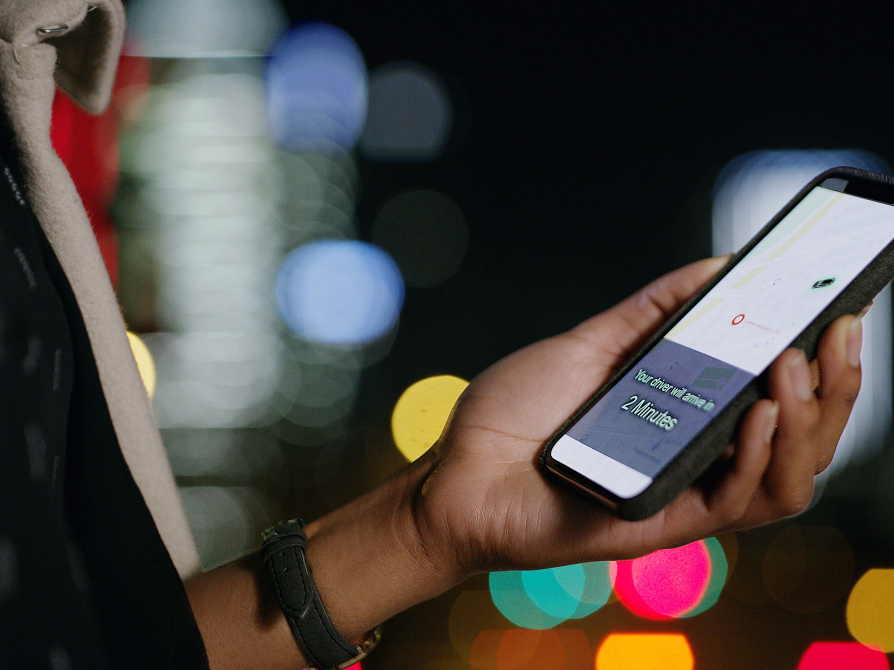 A person orders a taxi using their smartphone