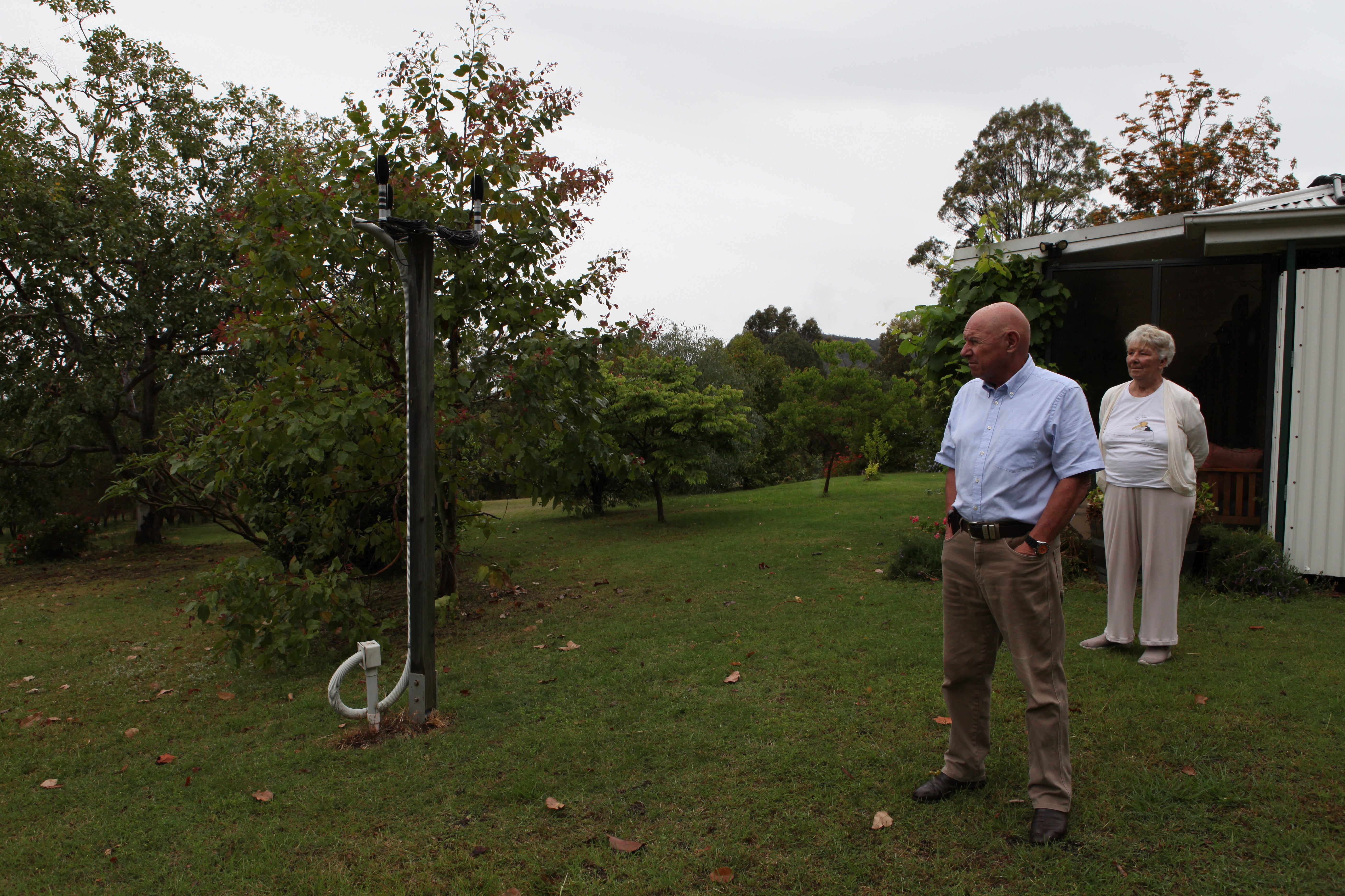 Alan and Judith Leslie look at microphones a mining company put on their property to monitor noise